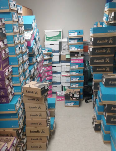 The Juneau School District gratefully accepted almost 250 pair of new winter boots from Juneau Fred Meyer to distribute to schools for children in need.