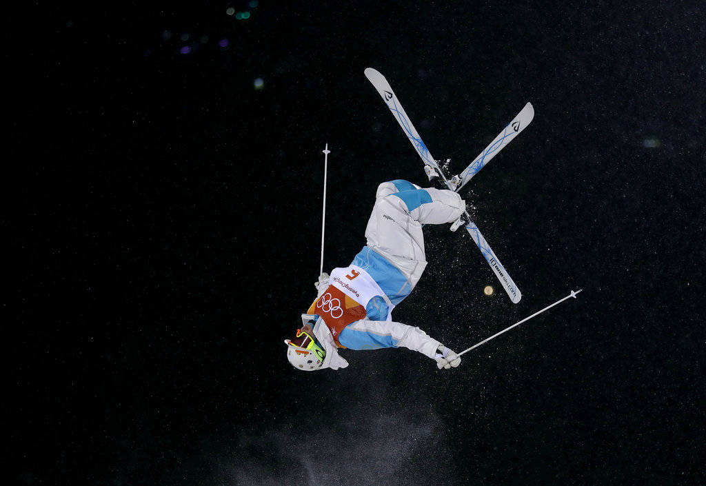 Yulia Galysheva, of Kazakhstan, jumps during the women’s moguls finals at Phoenix Snow Park at the 2018 Winter Olympics in Pyeongchang, South Korea, Sunday, Feb. 11, 2018. (Gregory Bull | The Associated Press)