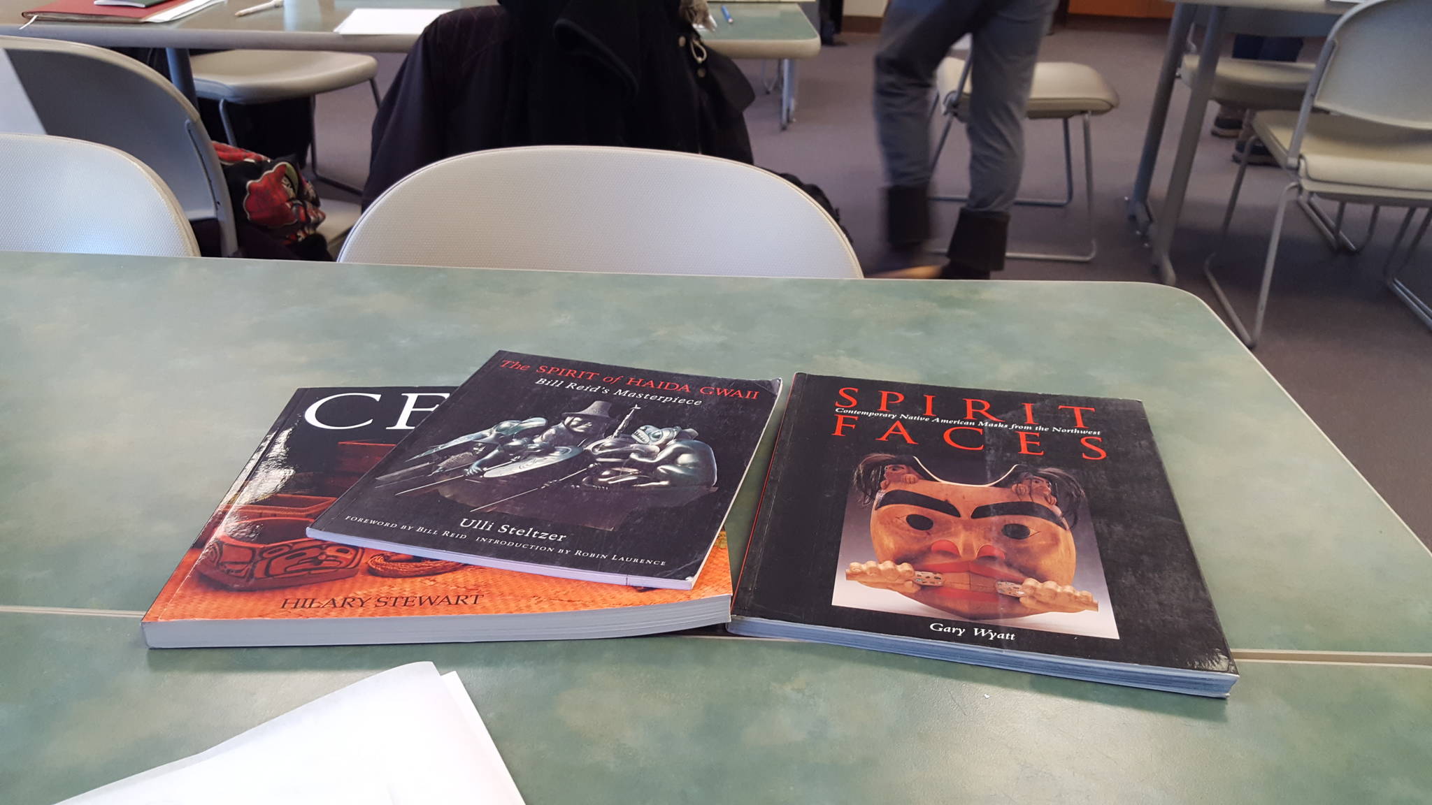 Arts and culture books on Alaska Native peoples from Xh’unei Lance Twitchell’s personal collection sit on a table for workshop participants to thumb through. Clara Miller | Capital City Weekly