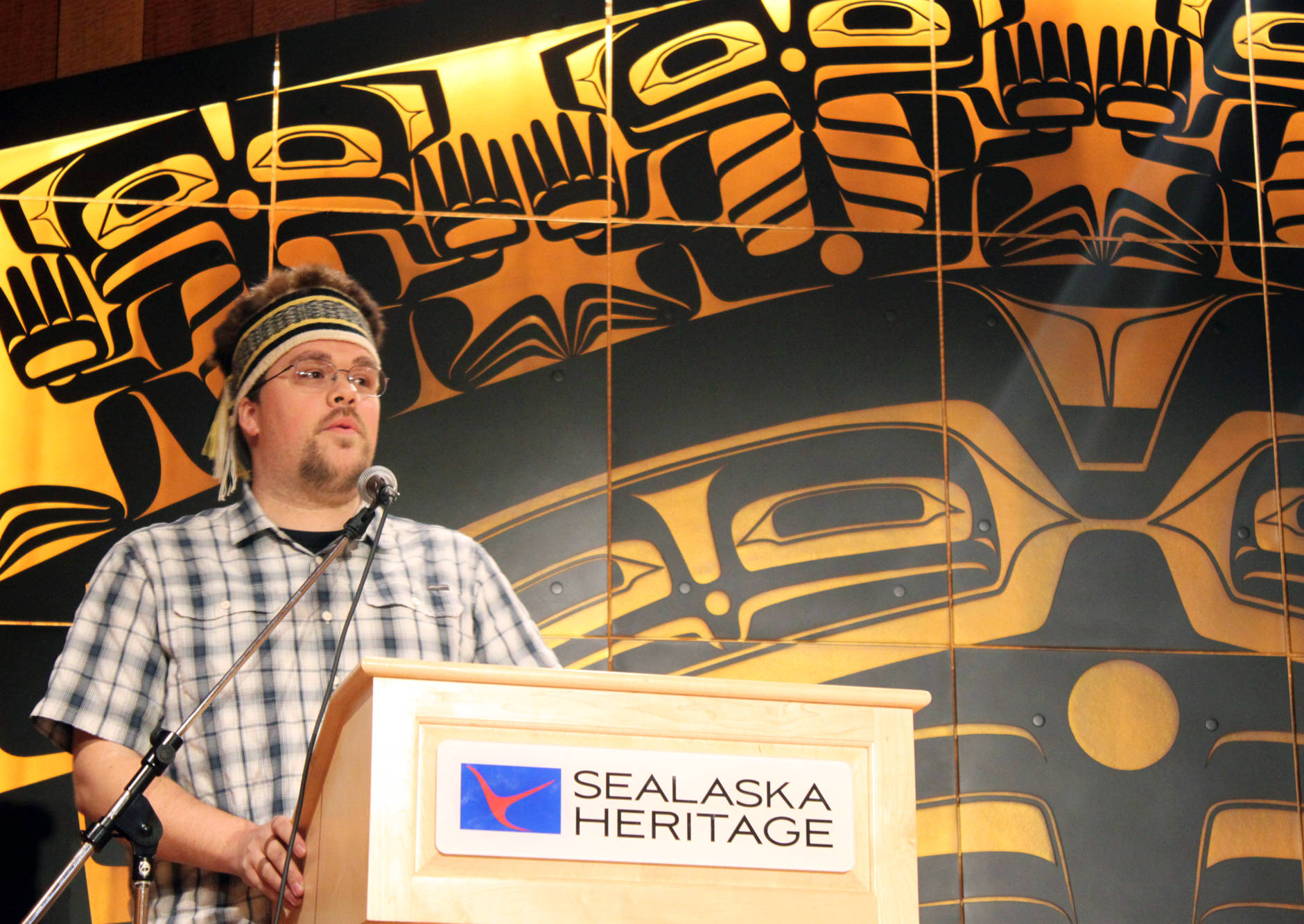 In this June 2016 photo, David R. Boxley gives an acceptance speech for winning “Best of Show” in the Northwest Coast Juried Art Show during the awards ceremony in the Walter Soboleff Building’s clan house. (Lisa Phu | Juneau Empire File)