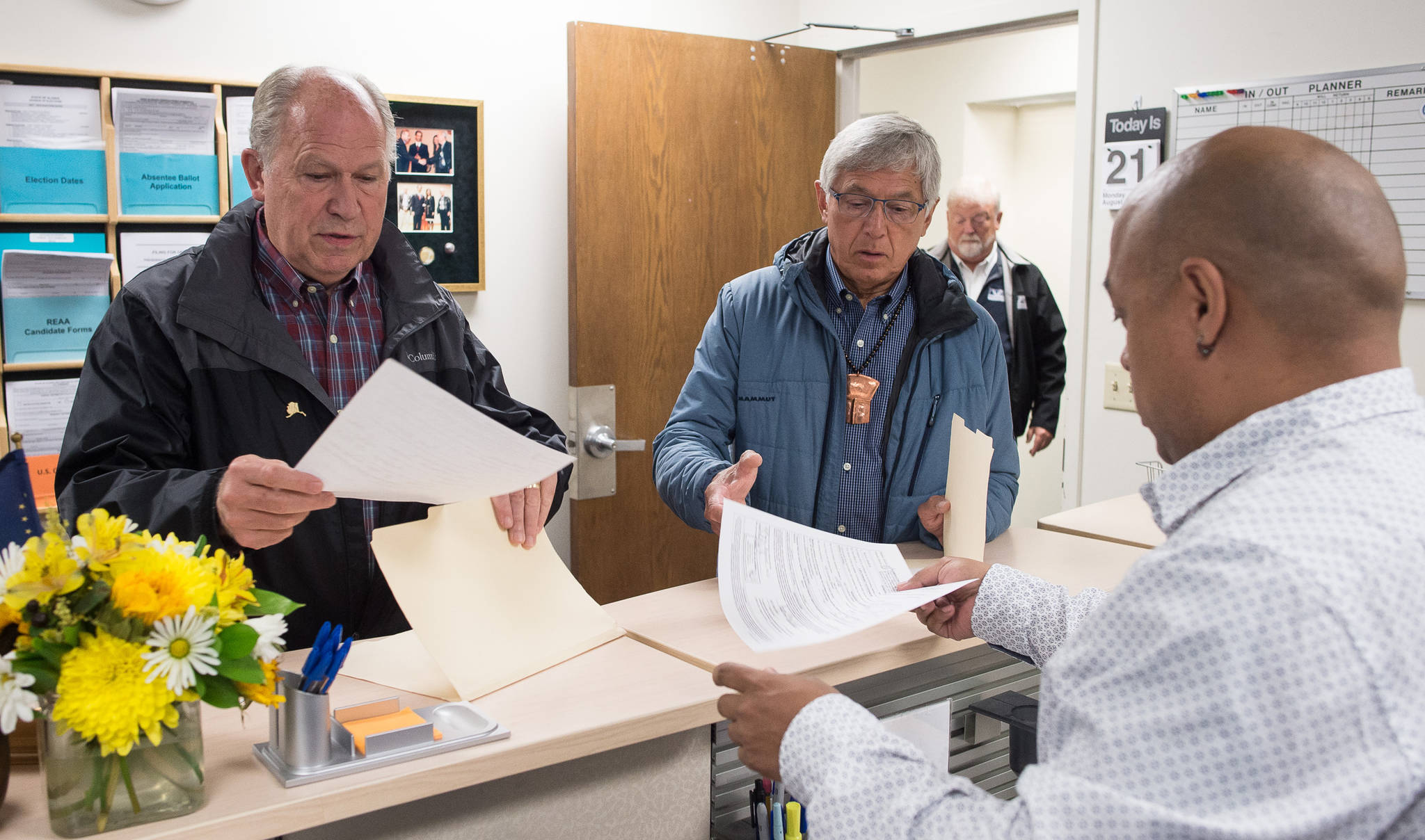 Gov. Bill Walker and Lt. Gov. Byron Mallott file for re-election at the state’s election office in Juneau on Monday, Aug. 21, 2017. (Michael Penn | Juneau Empire)