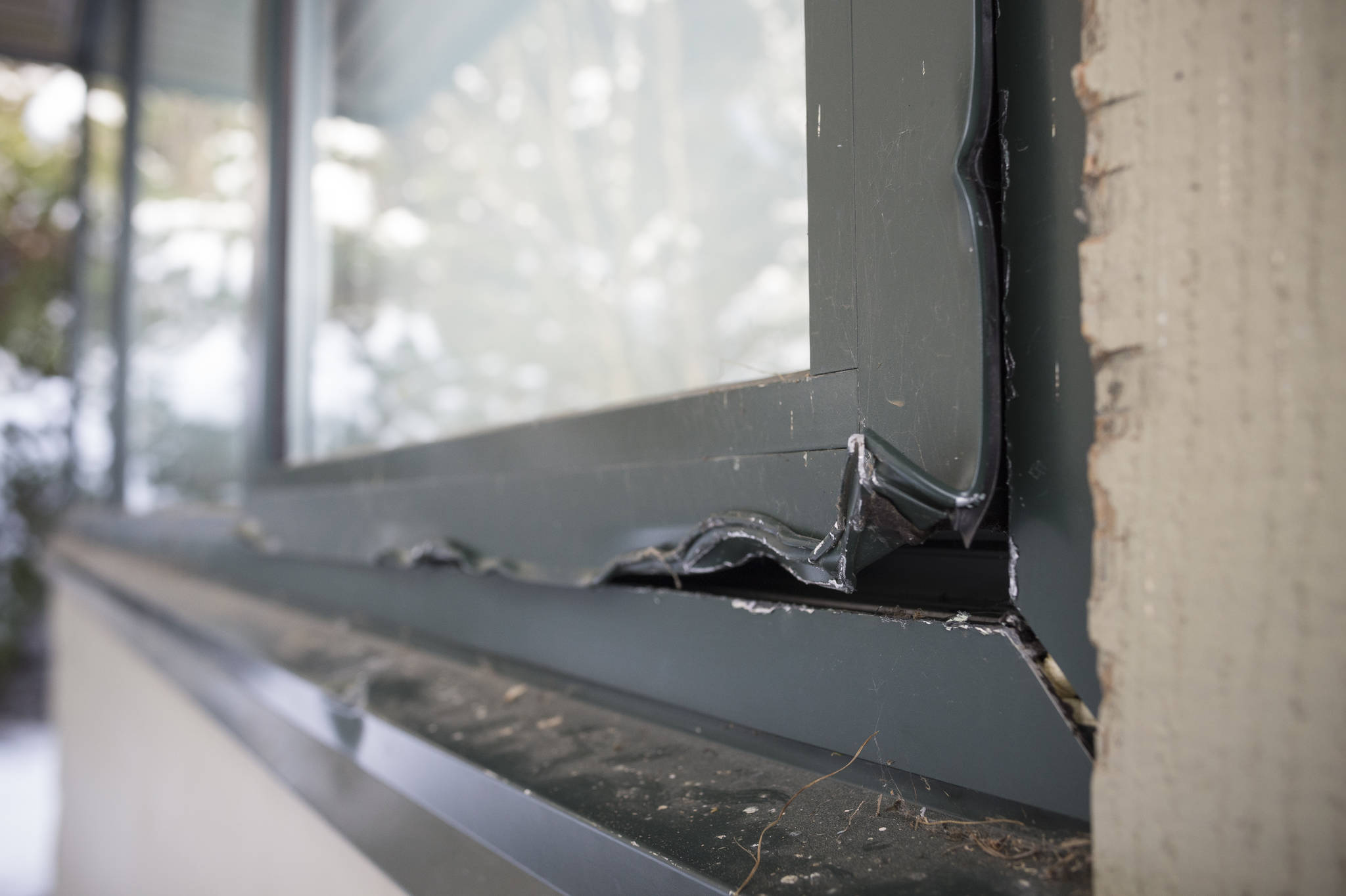 One of four windows that show damage on the backside of Dzantik’i Heeni Middle School on Monday, Feb. 19, 2018. (Michael Penn | Juneau Empire)