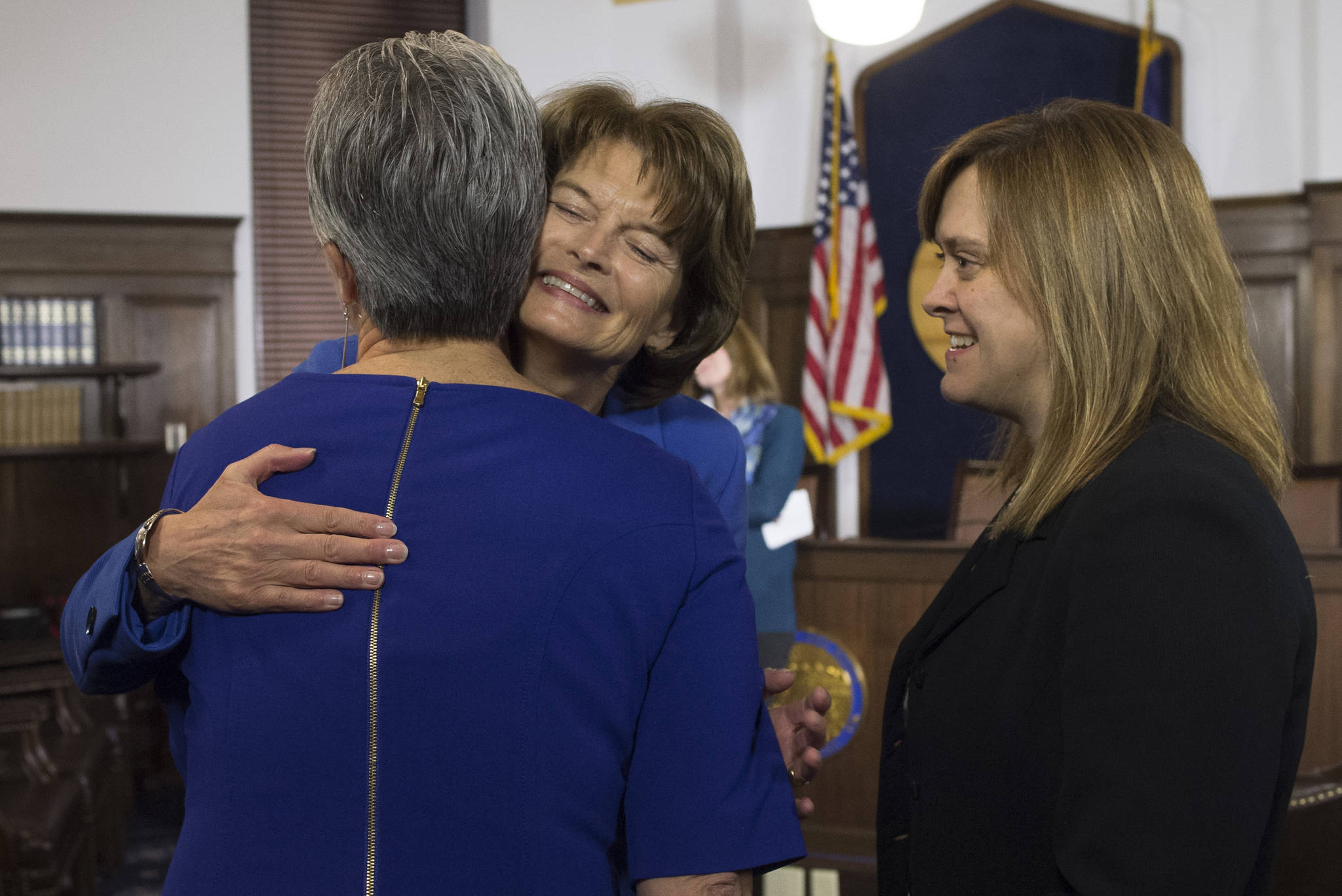 U.S. Sen. Lisa Murkowski, R-Alaska, center, is greeted by Sen. Anna MacKinnon, R-Eagle River, left, and Sen. Mia Costello, R-Anchorage, after her speech to a joint session of the Alaska Legislature at the Capitol on Thursday, Feb. 22, 2018. (Michael Penn | Juneau Empire)