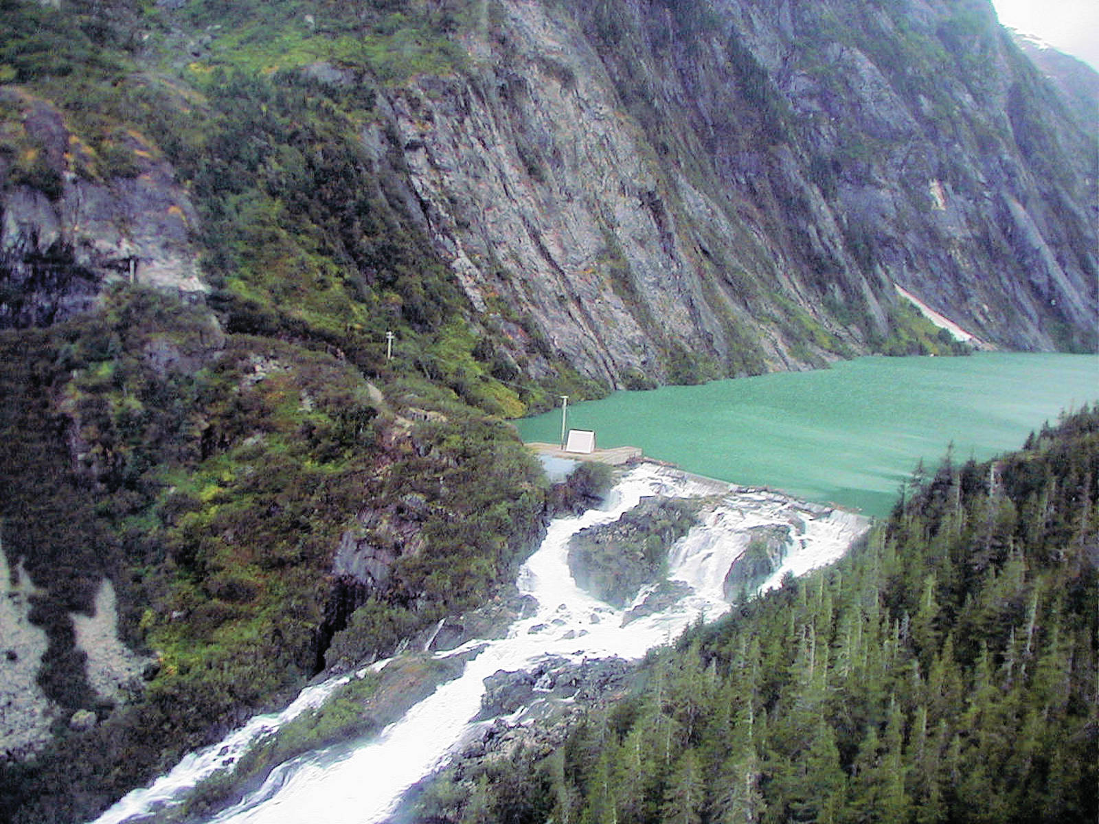 The damming of Long Lake south of Juneau allowed for the construction of the Snettisham Hydroelectric project in the 1960s, which has provided low-cost power to the state capital ever since. A pending sale that could allow the dam to become owned by a Canadian utility is drawing objections from across the state and its lone U.S. Rep. Don Young. (Photo/Courtesy/Alaska Industrial Development and Export Authority)