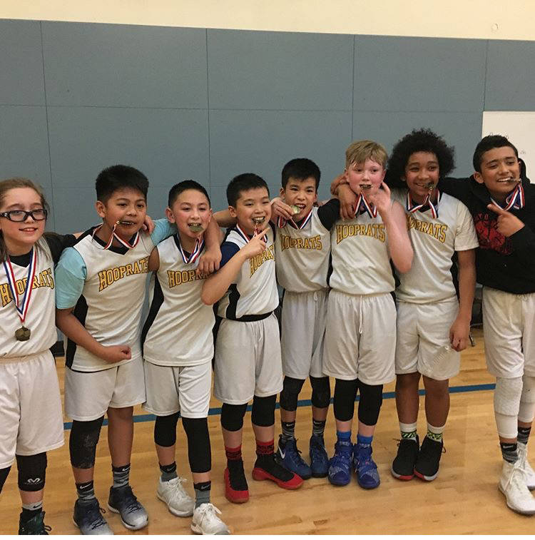 The sixth-grade travel team from Juneau’s Hoop Rat Basketball Club pose with their first-place medals after defeating Kent Elite 63-50 in the sixth-grade championship game Monday, Feb. 19, in Seattle. L to R: Lamar Blatnick, Lance Nierra, Alwen Carrillo, TJ Guevarra, Ernel Penalosa, Sean Oliver, DeAndrew Pittman, Antone Araujo. Not pictured: Coaches Todd Araujo and Larry Cooper. (Courtesy Photo | Jaeleen Kookesh)