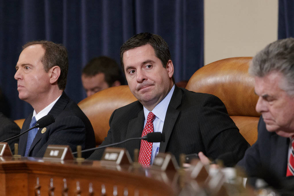 In this March 20, 2017, file photo, House Intelligence Committee Chairman Rep. Devin Nunes, R-Calif., center, flanked by the committee&rsquo;s ranking member Rep. Adam Schiff, D-Calif., left, and Rep. Peter King, R-N.Y., listens on Capitol Hill in Washington during the committee&rsquo;s hearing on allegations of Russian interference in the 2016 U.S. presidential election. (AP Photo/J. Scott Applewhite, File)