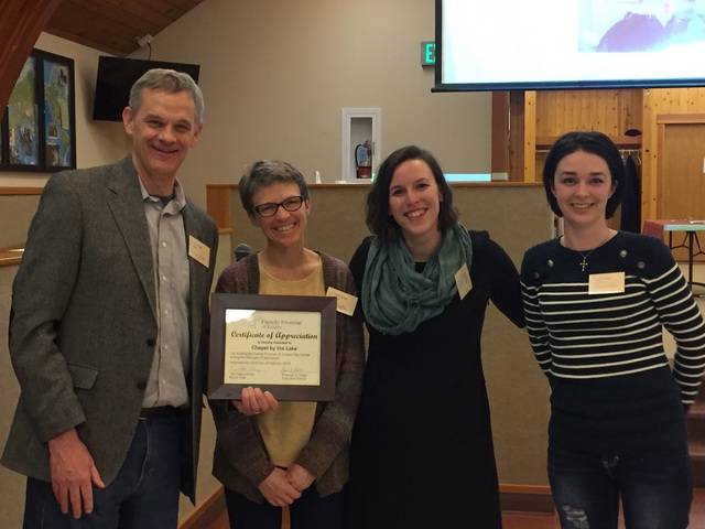 Rev. Tari Stage-Harvey board chair and Shannon Fisher Executive Director thank Rev. Douglas Dye (left) and church administrator Jessica Rider (right) for Chapel by the Lake&rsquo;s support of Family Promise