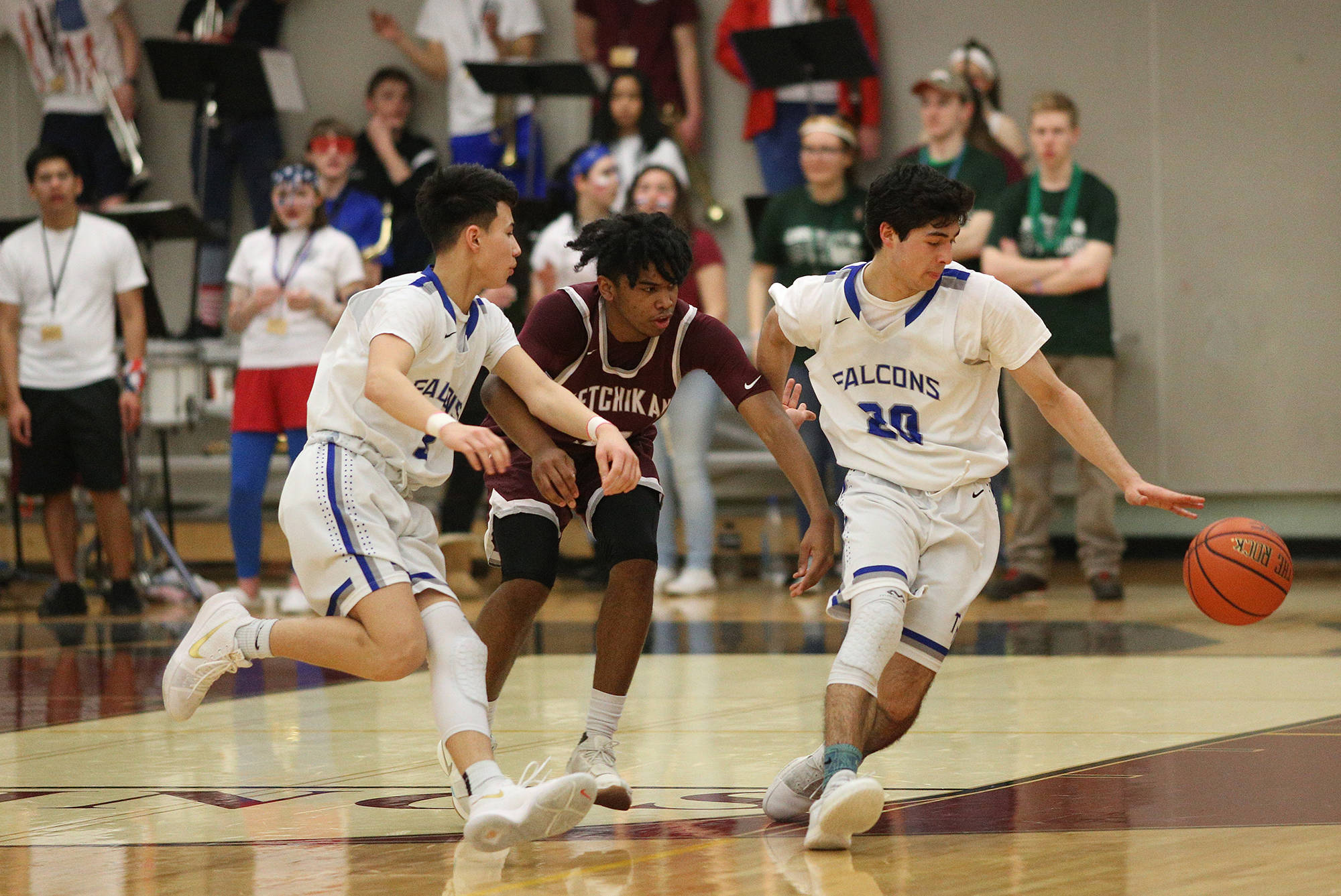 Thunder Mountain’s Josh McAndrews dribbles past Kayhi’s Chris Lee Wednesday night in the Region V 4A tournament. The Kings defeated the Falcons 49-47 to advance to the boys championship game on Friday. Thunder Mountain plays JDHS today at 1:15 p.m. today in the loser’s bracket. (Dustin Safranek | Ketchikan Daily News)