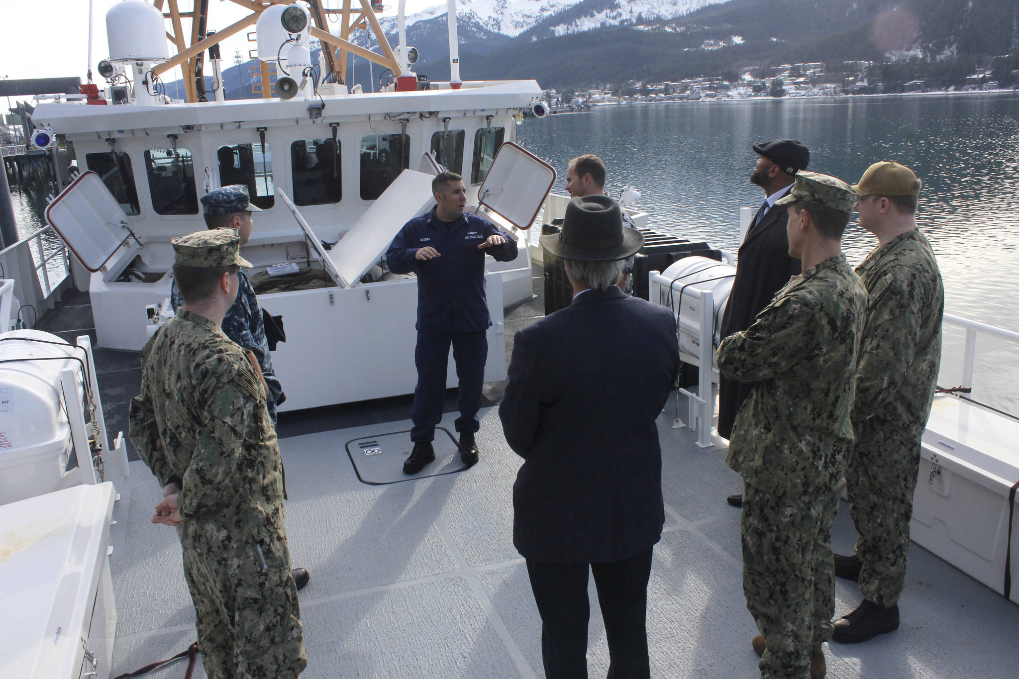 Chief Boatswains Mate Matt Oliveira speaks to representatives from the U.S. Navy on March 13, 2018 on the deck of the U.S. Coast Guard Cutter John McCormick. (Alex McCarthy | Juneau Empire)