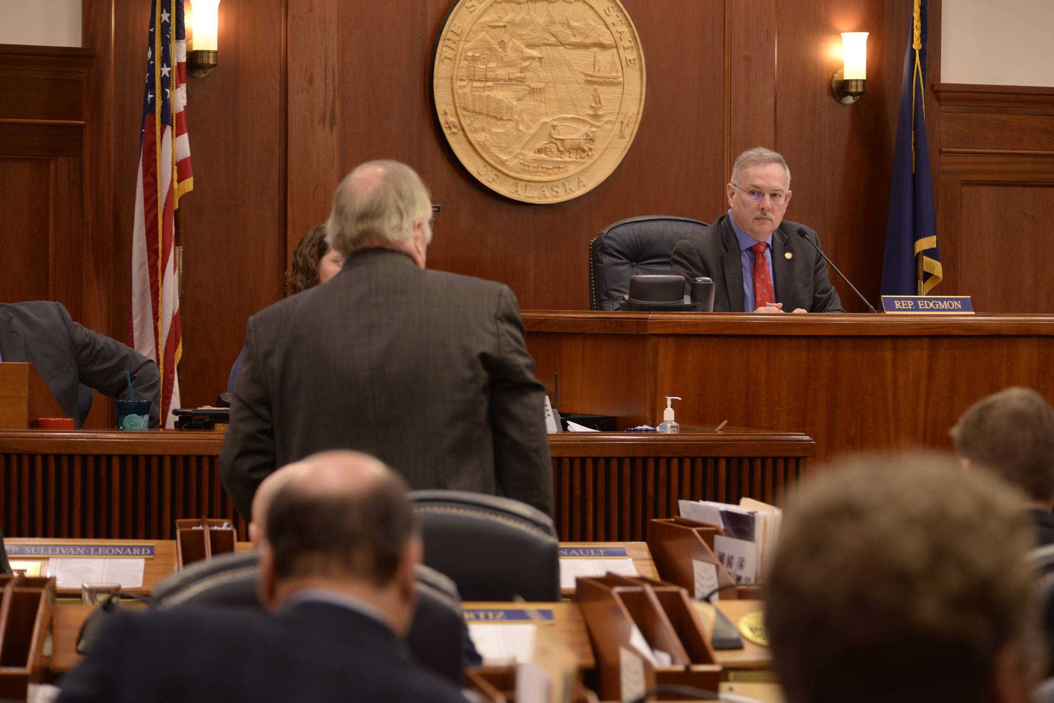 Rep. Mike Chenault, R-Nikiski, presents House Concurrent Resolution 10 to Speaker of the House Bryce Edgmon, D-Dillingham on Monday, March 19, 2018 in the Alaska State Capitol. (Brian Hild | Alaska House Majority)