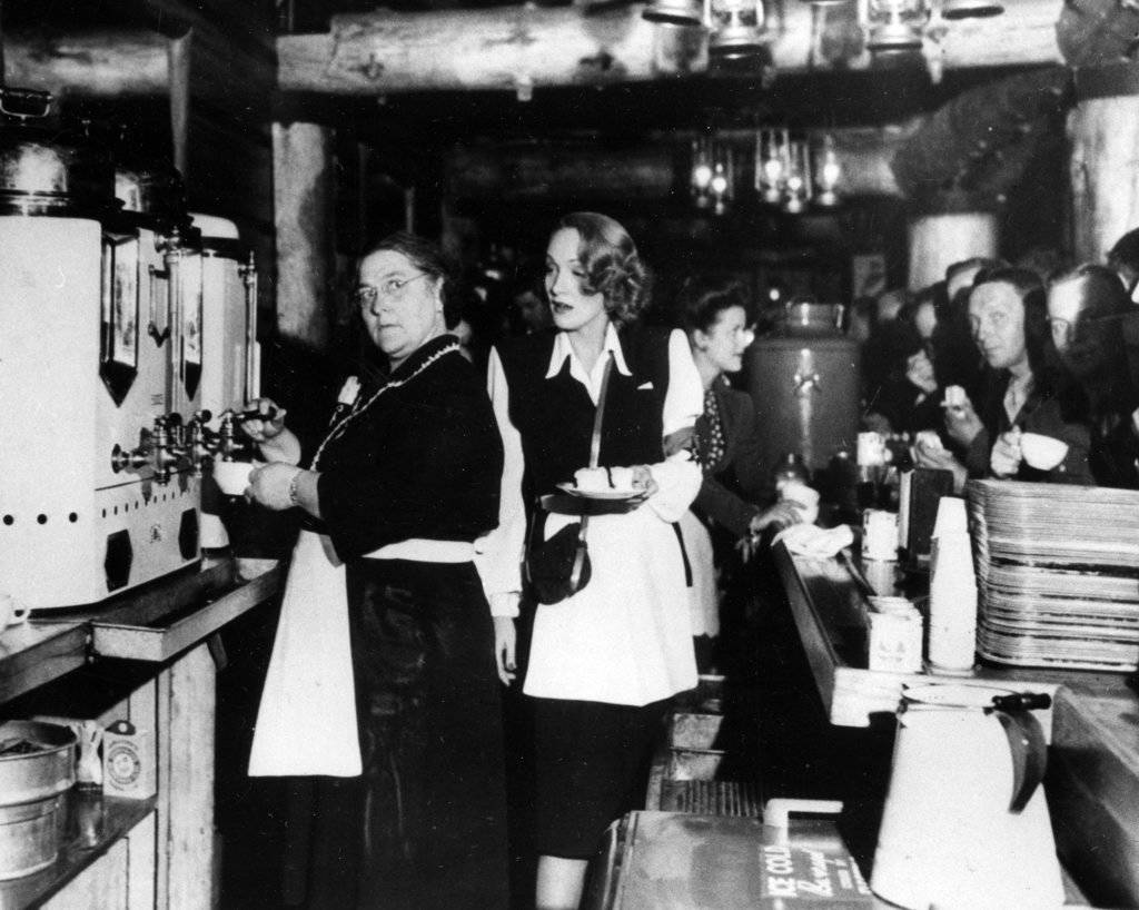 In this Feb. 9, 1944 photo, Alleta Sullivan, left, mother of the five Sullivan brothers who lost their lives in the sinking of the cruiser USS Juneau, works alongside actress Marlene Dietrich as they serve servicemen in the USO Hollywood Canteen, Calif. Philanthropist and Microsoft co-founder Allen announced March 17, 2018 that wreckage of the sunken ship on which five brothers died in World War II has been discovered in the South Pacific. The ship was hit by Japanese torpedoes in 1942, killing hundreds of men, including the five Sullivan brothers from Waterloo, Iowa. (The Associated Press File)