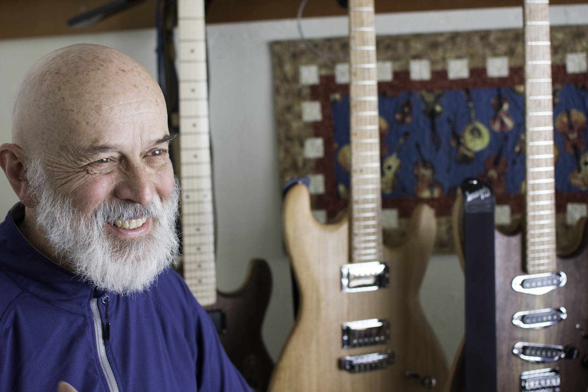 George Gress speaks with a reporter at his home in Juneau on Tuesday, March 27, 2018 about his three-year tenure making guitars for clients across the country. Richard McGrail | For the Capital City Weekly