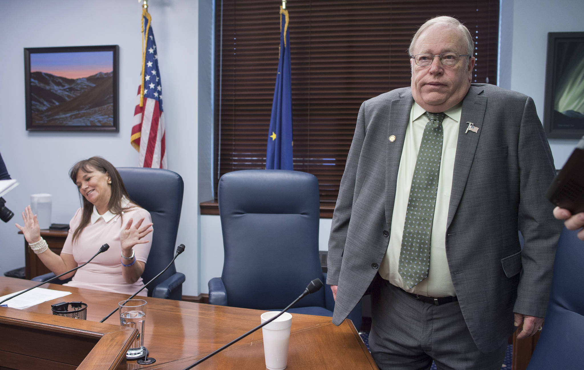House Majority Leader Charisse Millett, R-Anchorage, left, and former Speaker of the House Rep. Mike Chenault, R-Nikiski, react to reporters questions about the state’s budget during a press conference at the Capitol on Thursday, March 29, 2018. (Michael Penn | Juneau Empire)
