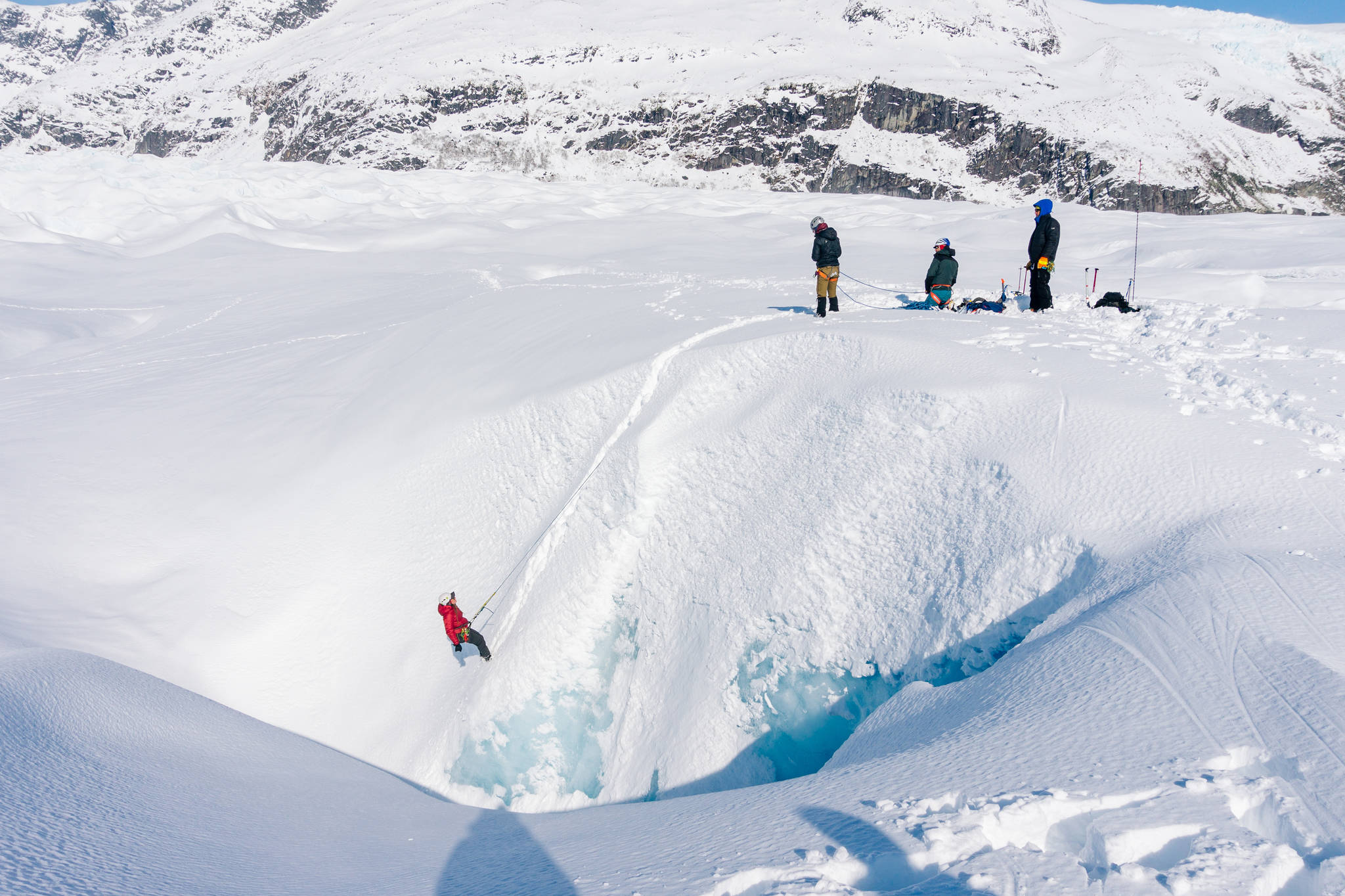 Using snow anchors we pactice belaying on a Munter hitch. (Photo by Gabe Donohoe)