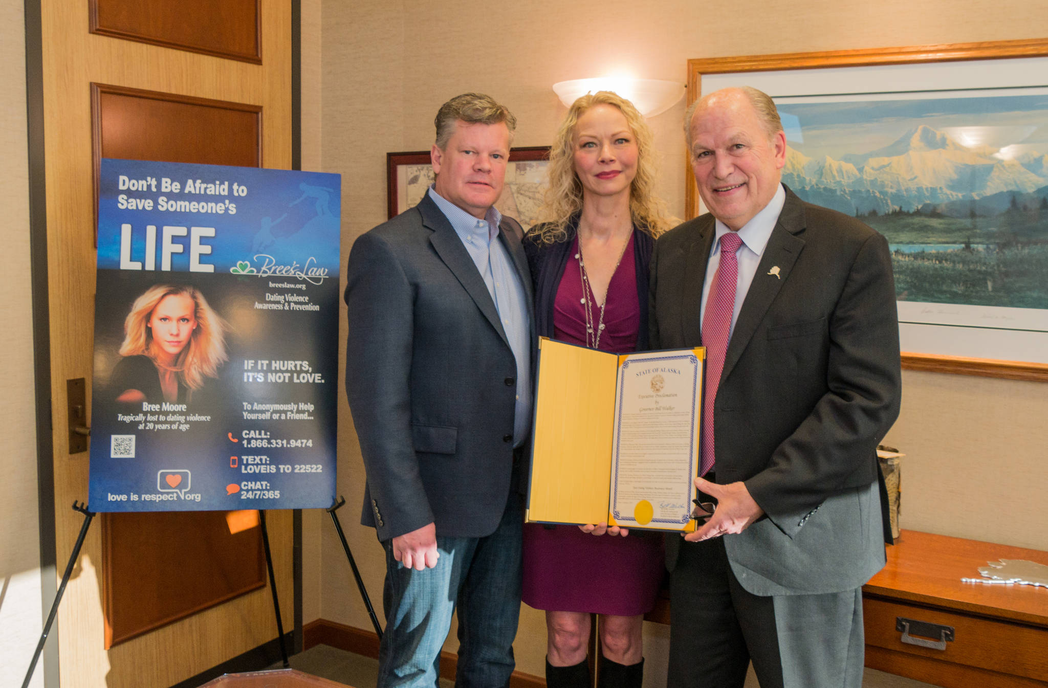 Gov. Bill Walker is seen with Butch and Cindy Moore on Feb. 2, 2018 after signing a teen dating violence prevention proclamation. Also present was House Minority Leader Charisse Millett, R-Anchorage (not pictured). (Brice Habeger | State of Alaska)