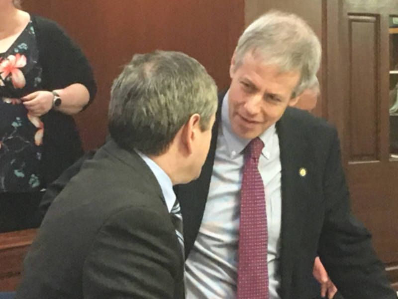 Rep. Matt Claman, D-Anchorage, discusses House Bill 25 on Monday, April 9, 2018 on the floor of the Alaska House of Representatives with House Majority Leader Chris Tuck, D-Anchorage (left). (James Brooks | Juneau Empire)