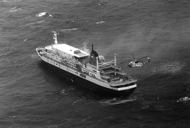 A rescue helicopter takes off the remaining crew and passengers of the Prinsendam who weren’t able to get into a lifeboat. Photo courtesy of the U.S. Coast Guard.