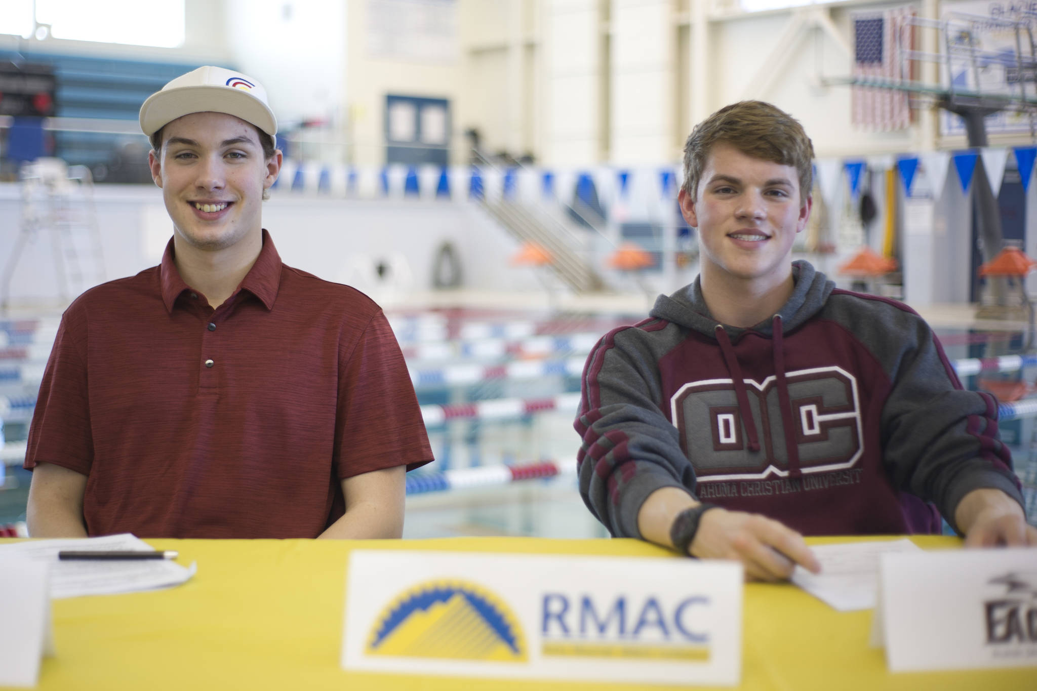 Thunder Mountain High School swimmers Casey Hamilton, left, and Bergen Davis after signing national letter of intents at the Dimond Park Aquatics Center on Wednesday. Hamilton is headed to Mesa College in Grand Junction, Colorado, and Davis is off to Oklahoma Christian University in Edmond, Oklahoma. (Nolin Ainsworth | Juneau Empire)