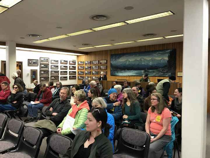 Members of the community sit in during discussions of the City’s mining ordinance at the Committee of the Whole Meeting at Assembly Chambers Monday. (Gregory Philson | Juneau Empire)