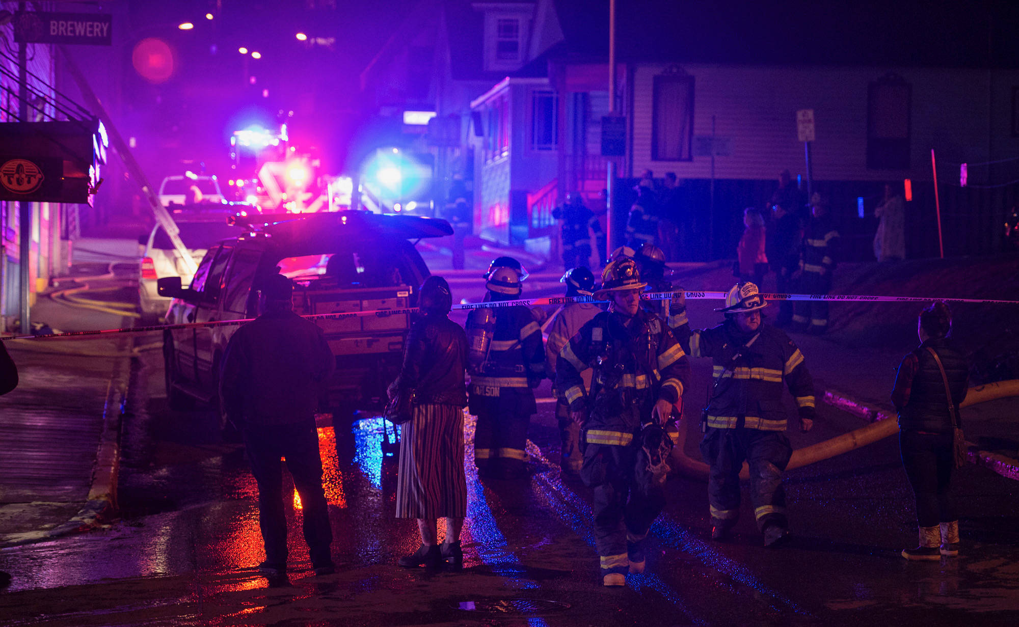 Juneau Capital City Fire/Rescue firefighters work a building fire at North Franklin and Second Street on Monday, April 16, 2017. (Michael Penn | Juneau Empire)