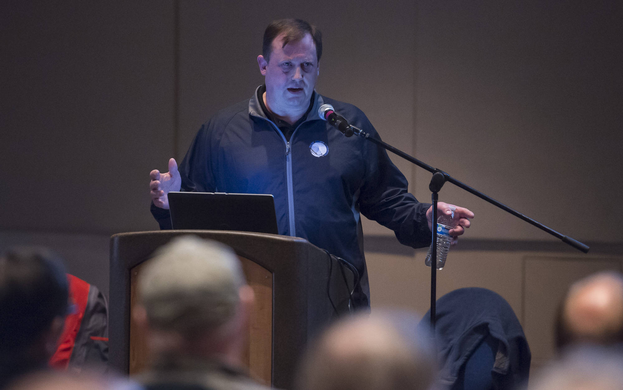 Ed Jones, Fish and Game Coodinator for the Division of Sport Fish at the Department of Fish and Game, speaks during the King Salmon Symposium sponsored by the Territorial Sportsmen at Centennial Hall on Monday, April 16, 2018.