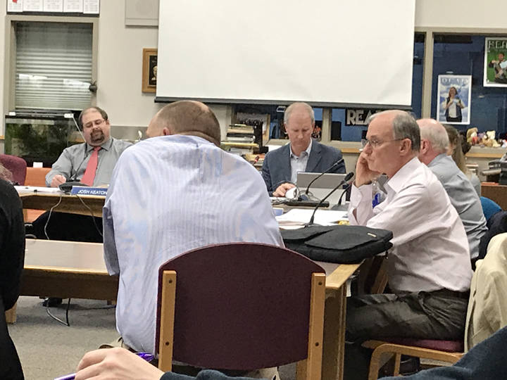 Juneau School District Board of Education member Jeff Short listens to a presentation about the new science curriculum at the district’s middle and high school at Tuesday’s meeting. (Gregory Philson | Juneau Empire)