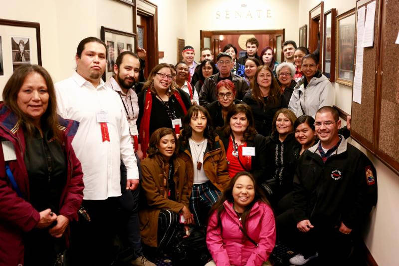 Participants in the Central Council of Tlingit and Haida Indian Tribes of Alaska’s 83rd annual Tribal Assembly pose in the Alaska Legislature on April 19, 2018 after breaking from the assembly to testify on House Concurrent Resolution 19. (Courtesy photo)