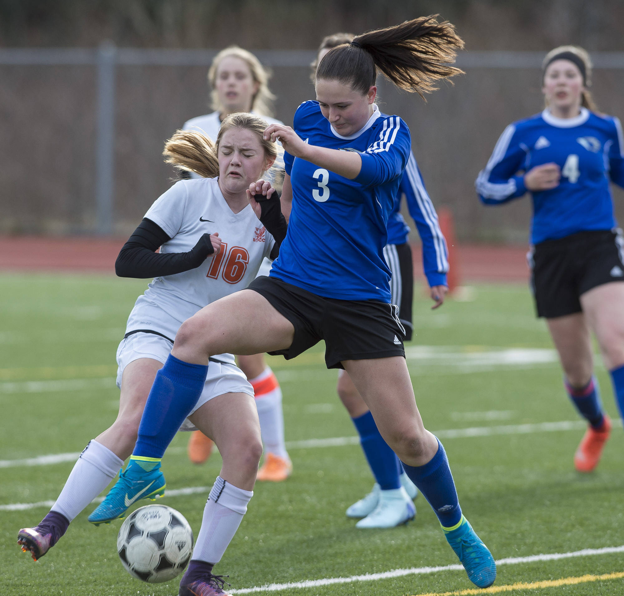 Thunder Mountain’s Macey Fuette, right, takes the ball from West’s Julia Johnson at TMHS on Friday. (Michael Penn | Juneau Empire)