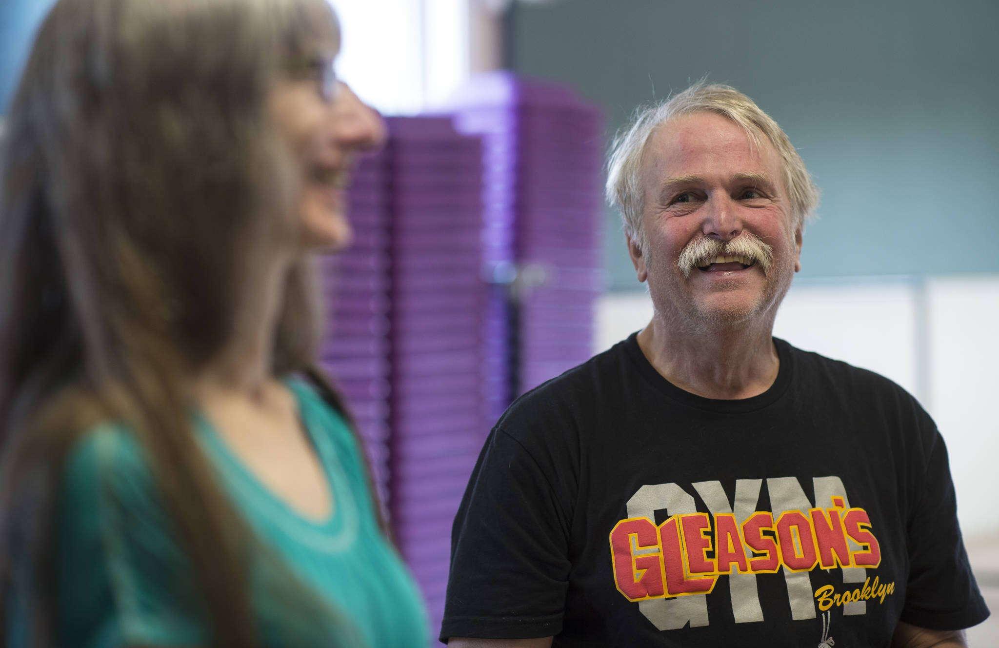 Richard Steele and his wife, Luann McVey, share a light moment while attending his workout at the Rock Steady Boxing Class at Pavitt Health & Fitness on Thursday, April 12, 2018. (Michael Penn | Juneau Empire)