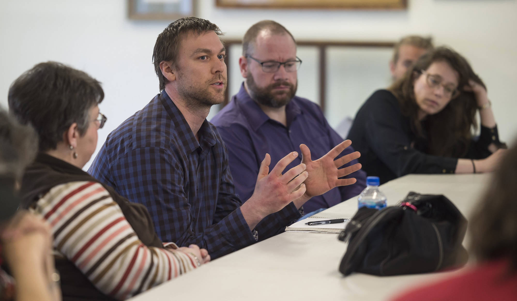 Aaron Surma, a consultant for Juneau Alliance for Mental Health, Inc. (JAMHI), speaks during a meeting of the Juneau Coalition on Housing and Homelessness at Gruening Park on Thursday, April 26, 2018. (Michael Penn | Juneau Empire)