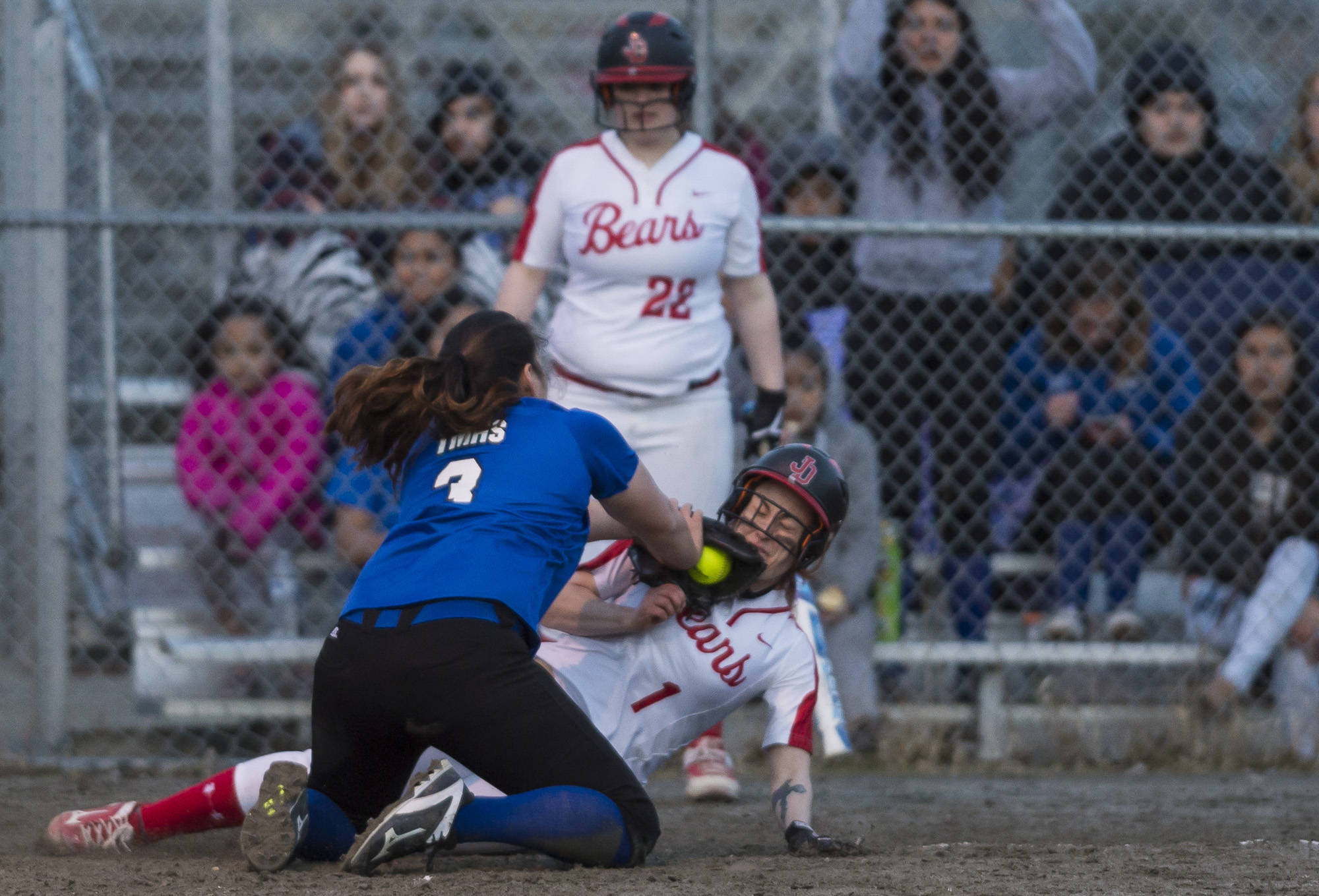 Thunder Mountain’s Nina Fenumiai, right, tags out Juneau-Douglas’ Elisa Fabrello trying to steal home on a passed ball at Dimond Park on Friday. TMHS won 11-4. (Michael Penn | Juneau Empire)