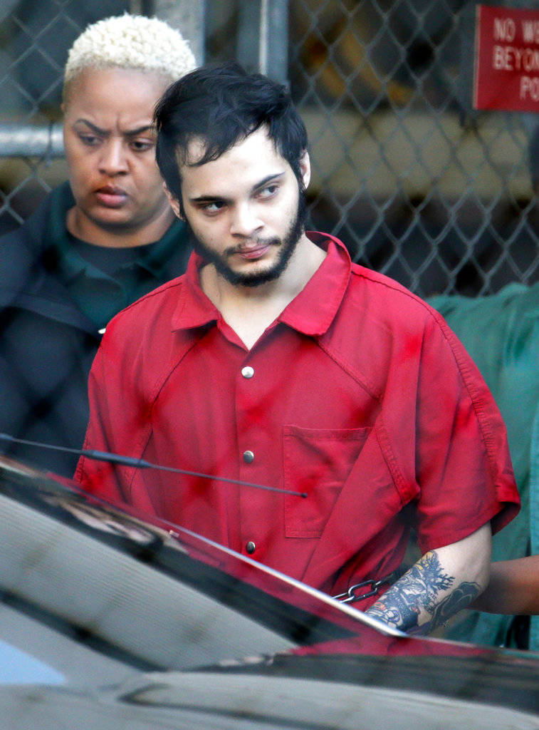 In this Jan. 30, 2017 photo, Esteban Santiago is escorted from the Broward County jail for an arraignment in federal court in Fort Lauderdale, Florida. The Justice Department has decided not to seek the death penalty against Santiago accused of killing five people and wounding six in a Florida airport shooting. Officials said Santiago of Anchorage, Alaska, will agree to a life sentence. The announcement was made in Miami on Tuesday, May 1, 2018. (Lynne Sladky | The Associated Press File)