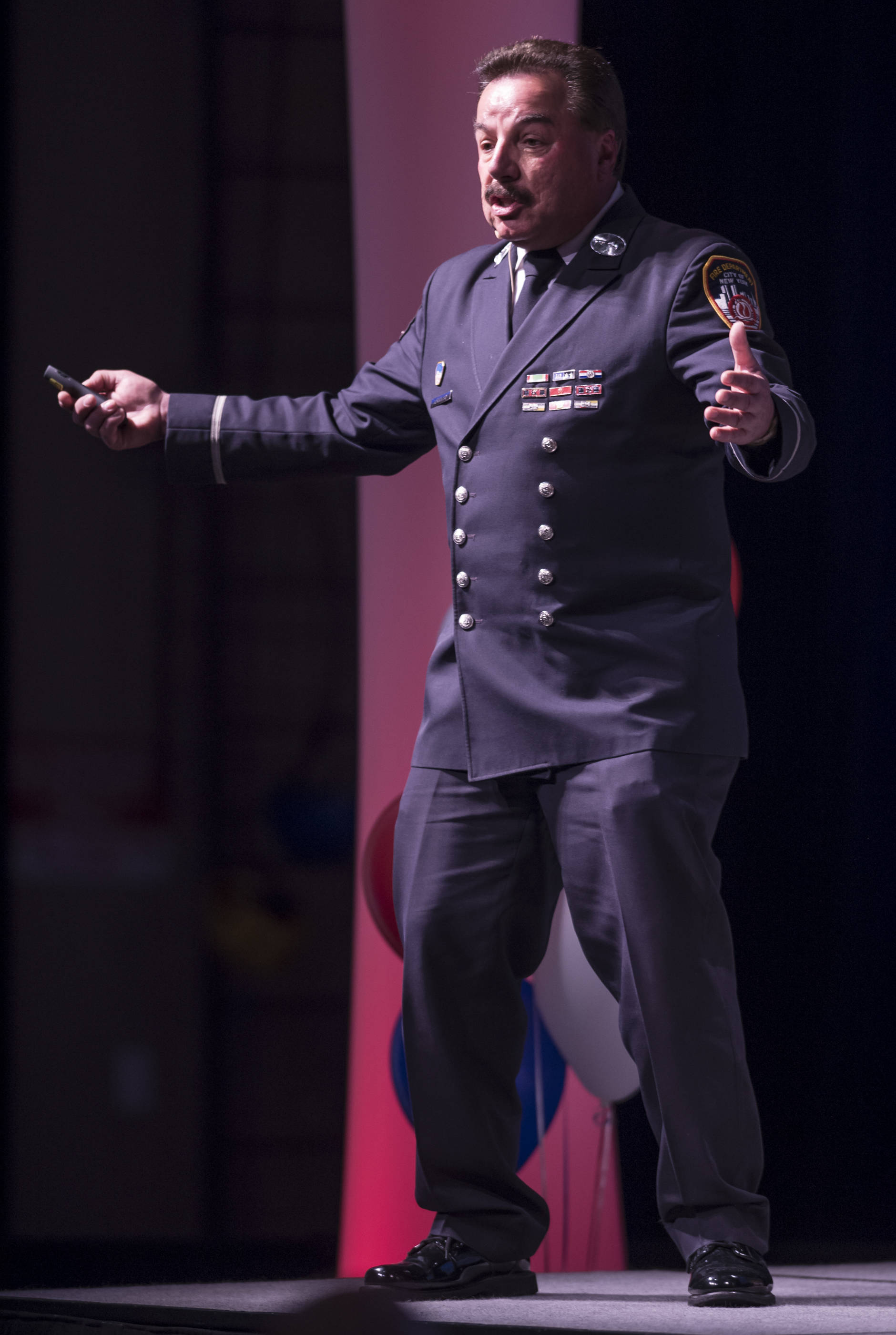 Joe Torrillo, retired from the New York City Fire Department, speaks during the Pillars of America speaker series at Centennial Hall on Wednesday, May 2, 2018. Torrillo tells his story of being buried twice during the collapse of the Twin Tower buildings in the Sept. 11, 2001. (Michael Penn | Juneau Empire)