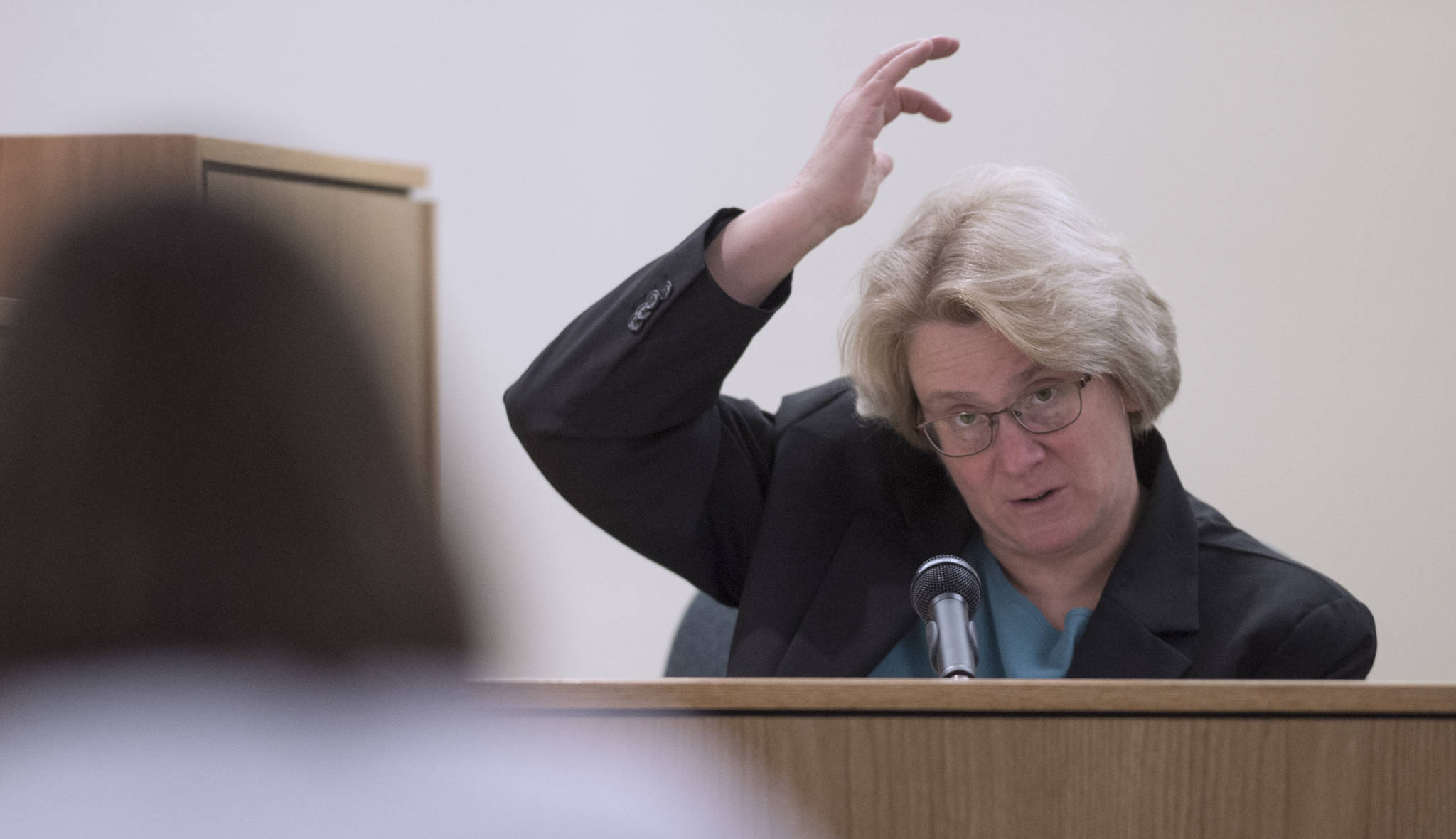 Deputy State Medical Examiner Cristin Rolf testifies in the trial of Mark De Simone in Juneau Superior Court on Thursday, May 3, 2018. De Simone is accused of killing Duilio Antonio “Tony” Rosales during a hunting trip in Excursion Inlet in 2016. (Michael Penn | Juneau Empire)