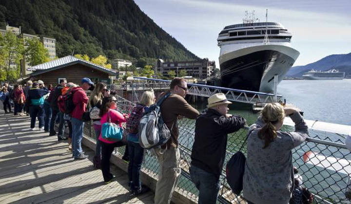 In this August 2015 photo, visitors line up to view Juneau’s downtown harbor. (Michael Penn | Juneau Empire File)