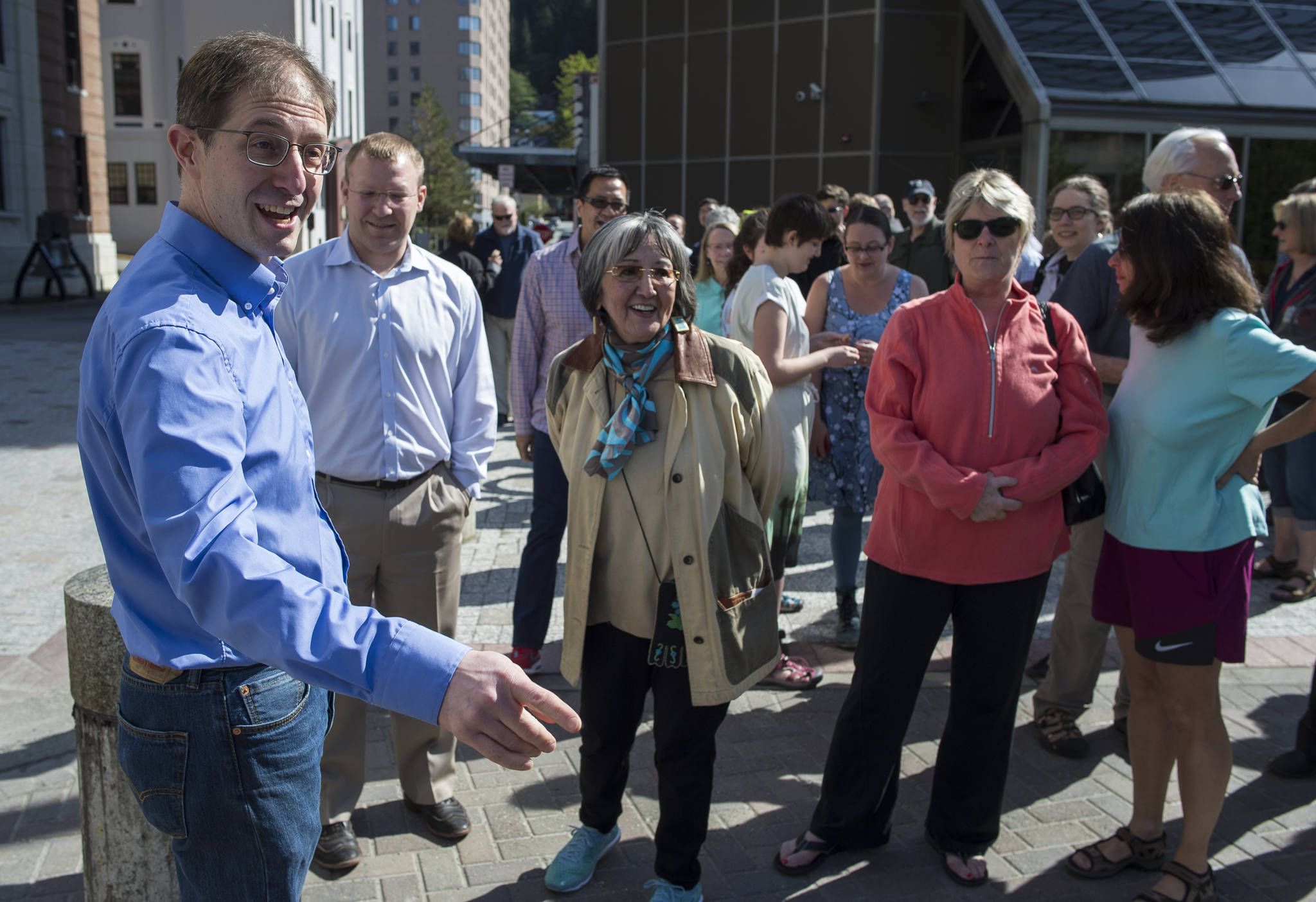 Jesse Kiehl, left, meets with supporters before his announcement to run for the Senate District Q seat in front of the Alaska State Capitol on Thursday, May 17, 2018. The seat is currently held by Sen. Dennis Egan who is not running for reelection. (Michael Penn | Juneau Empire)