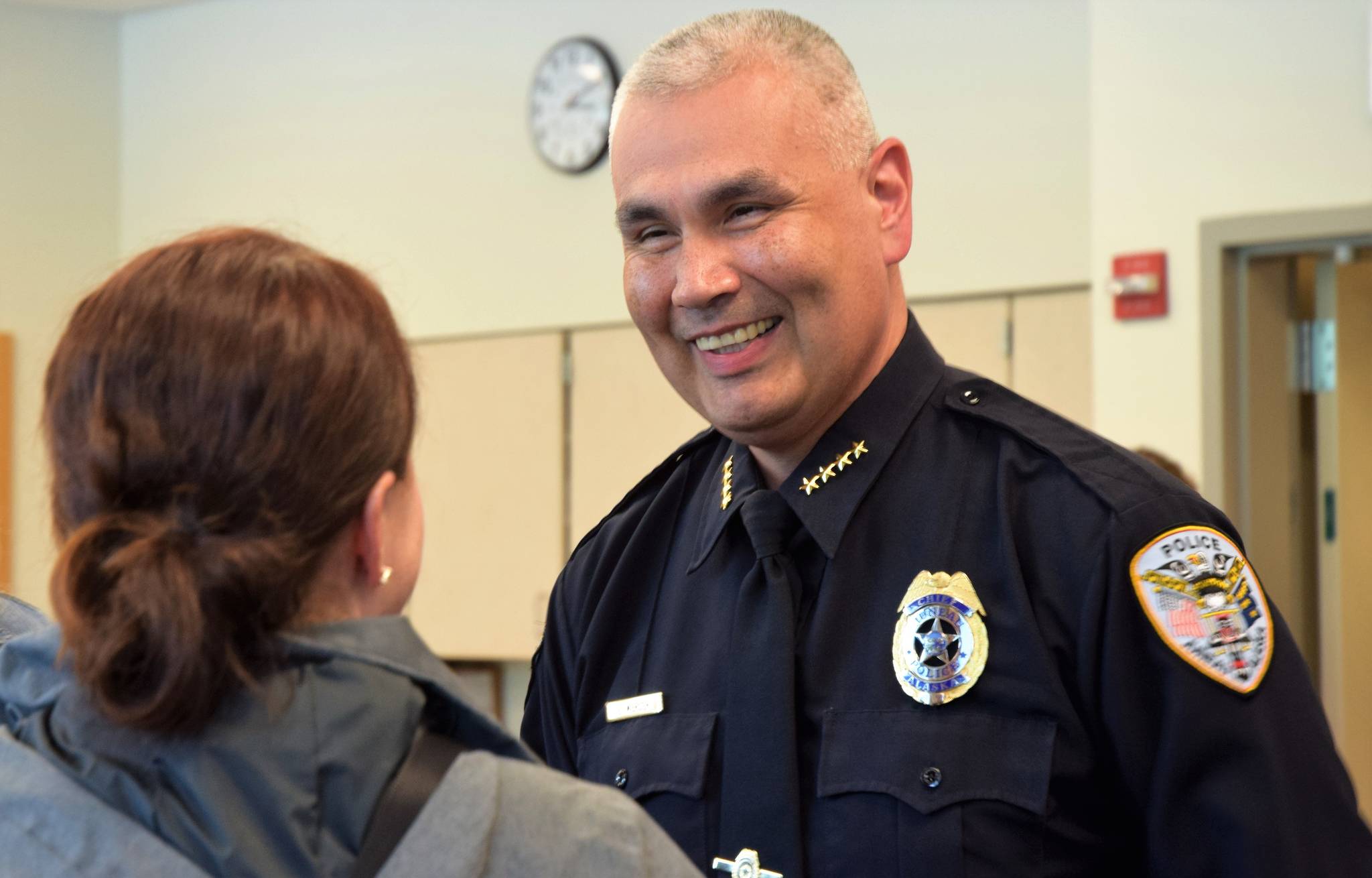 Juneau Police Department Chief Ed Mercer is all smiles while being congratulated by District Attorney Angie Kemp after his swearing-in Monday, July 31. (Liz Kellar | Juneau Empire File)