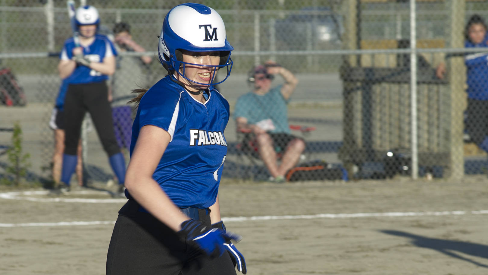 Thunder Mountain senior Peyton Harp tries to beat out a throw to first base on Friday night during the Falcons&rsquo; 13-0 win over Ketchikan. (Nolin Ainsworth | Juneau Empire)