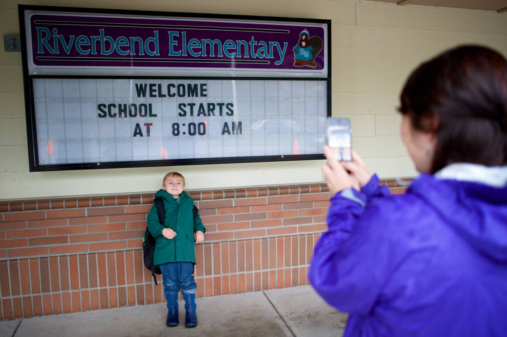 In this August 2015 photo, Christena Leamer photographs her son, Karson, a first-grader at Riverbend Elementary School on the first day of school. (Michael Penn | Juneau Empire File)