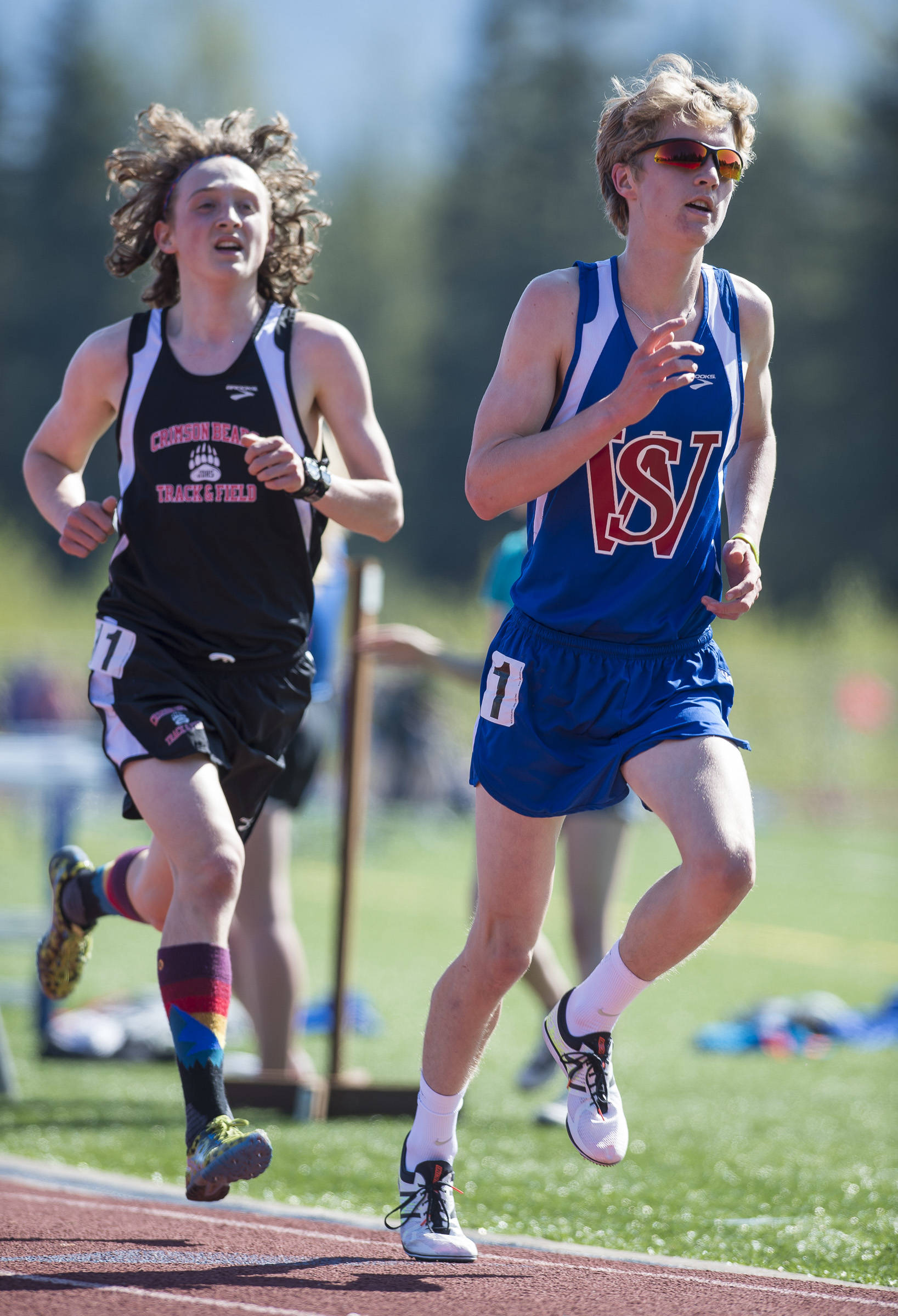 Sitka’s Dominic Baciocco, right, stays just ahead of Juneau-Douglas’ Arne Ellefson-Carnes in the 3200 meter final at the Region V Track & Field Championships at Thunder Mountain High School on Friday. (Michael Penn | Juneau Empire File)