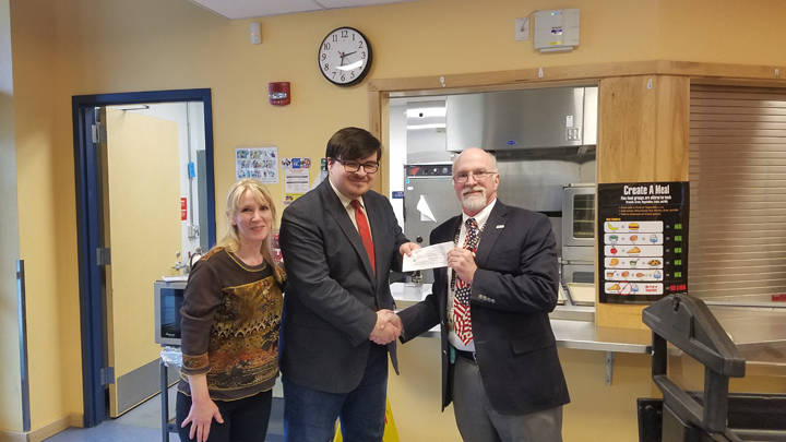 Alaska Native Brotherhood Camp 70 President Kevin Allen (center) presents a check to Juneau School District Superintendent Mark Miller and JSD Food Service Program Supervisor Adrianne Schwartz to support the universal breakfast program at middle schools. (Courtesy Photo | Juneau School District)