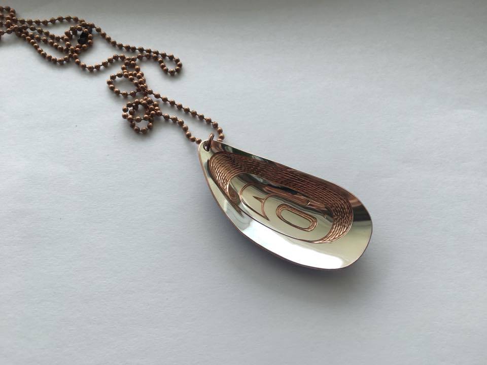 Engraved pendant of a mussel by Jennifer Younger. Photo courtesy of Jennifer Younger.