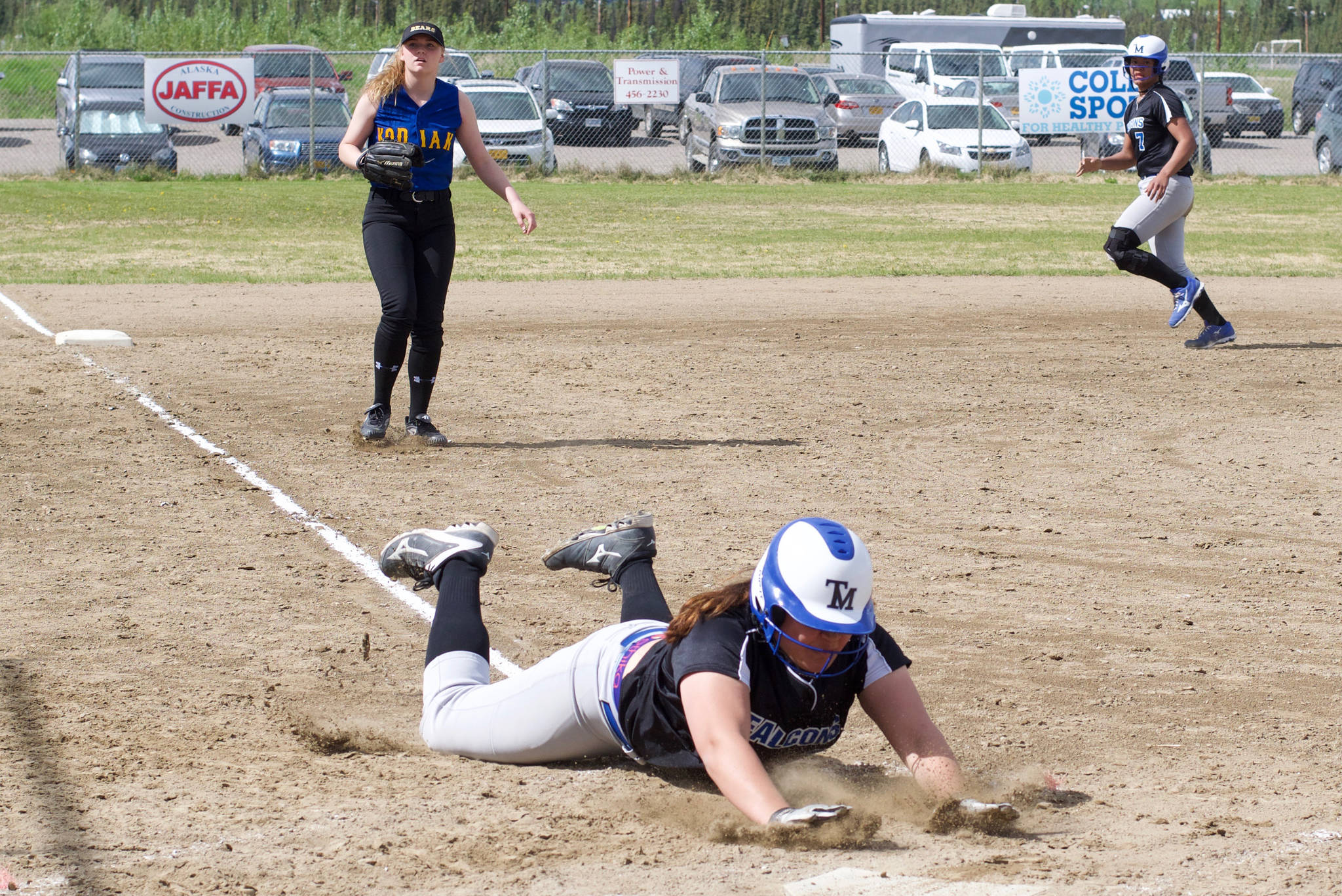 Thunder Mountain High School junior Nina Fenumiai slides head-first into home plate during the Falcons’ 8-0 win over Kodiak High School in the ASAA Division II state softball tournament on Thursday afternoon at South Davis Park in Fairbanks. The Falcons played North Pole later in the day and begin the double-elimination round on Friday. (Courtesy Photo | Sharla Hayes)