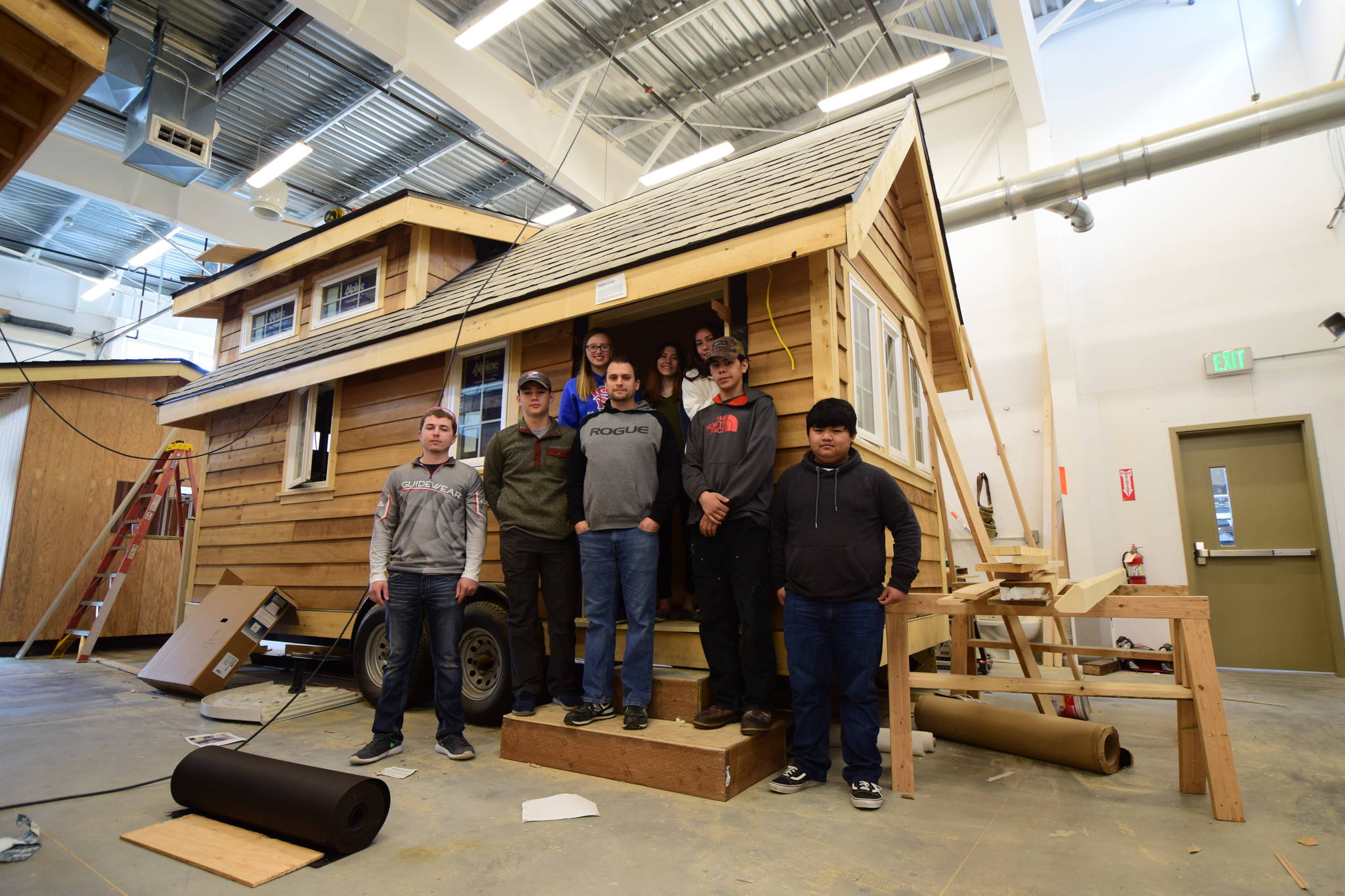Teacher Mike Vieira and students in Sitka High’s Advanced Construction class with the Tongass Tiny Home they helped build. Maia Mares | For the Capital City Weekly