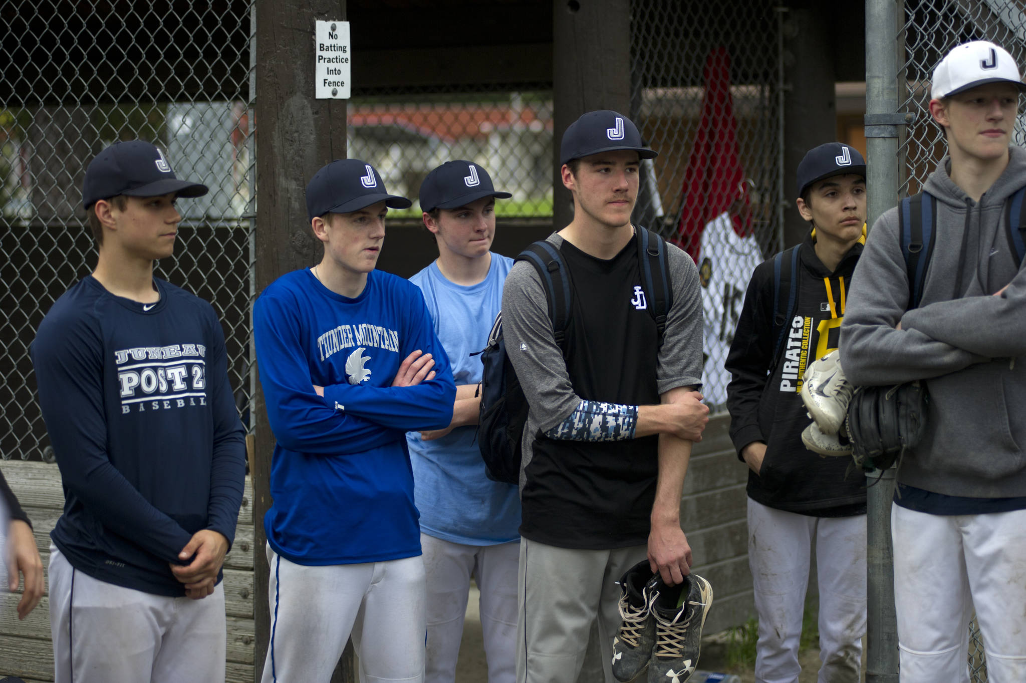 Juneau Post 25 players listen to the coaching staff after practice at Adair-Kennedy Memorial Park on Wednesday. (Nolin Ainsworth | Juneau Empire)