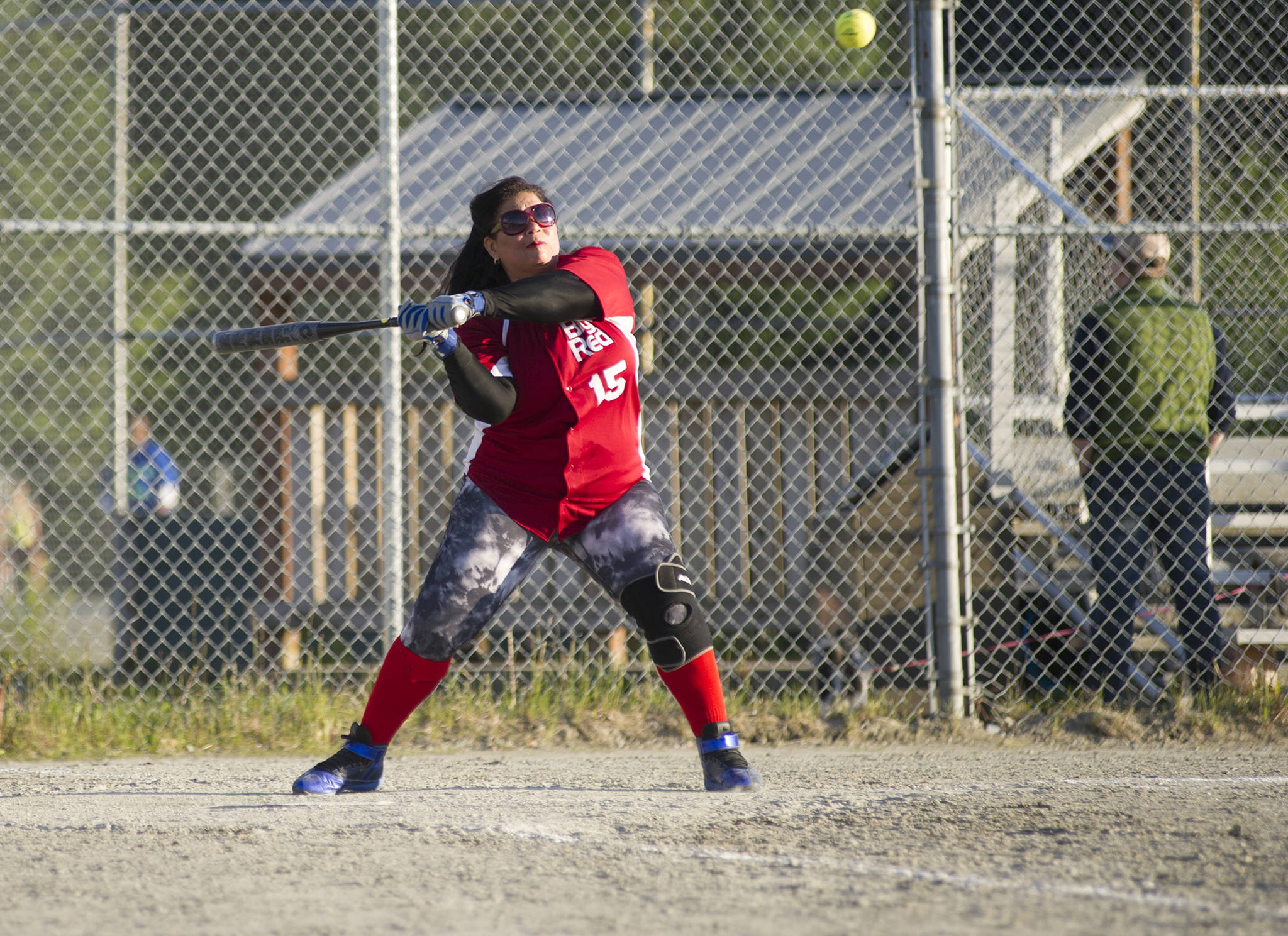 Big Red’s Dany Reyes lines up the ball at the 14th annual Capital City Coed Softball Tournament at Dimond Park on Friday, June 8, 2018. Big Red defeated Dirty Dozen 14-12. (Nolin Ainsworth | Juneau Empire)