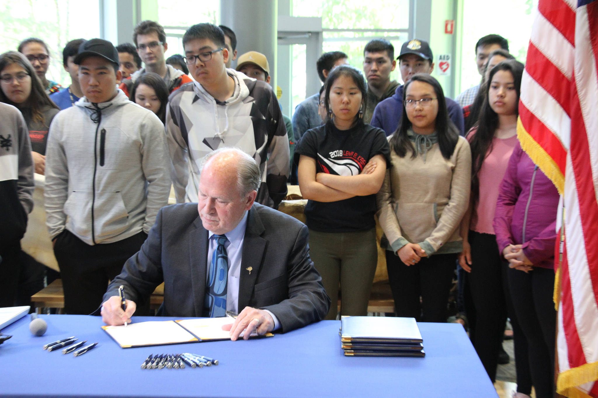 Alaska Gov. Bill Walker signs state spending bills during a ceremony Wednesday at the University of Alaska Anchorage. Walker did perform some line-item vetoes, including rejecting funding for a bridge project that would link Anchorage to the Matanuska-Susitna Borough and a Vitamin D deficiency study. (AP Photo/Mark Thiessen)