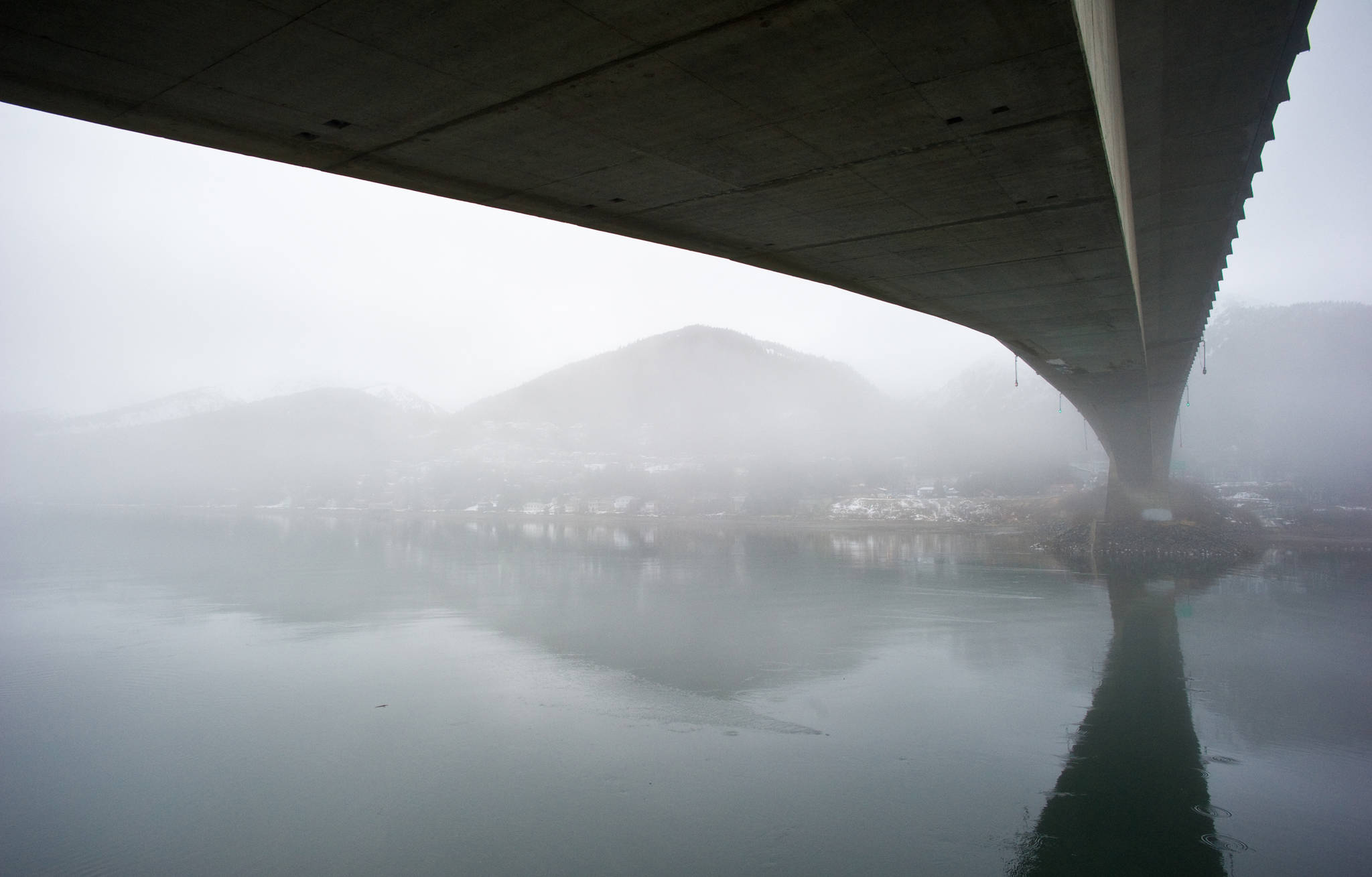 Morning fog shrouds Douglas Island near the Douglas Bridge on Wednesday, Jan. 8, 2014. (Michael Penn | Juneau Empire File)