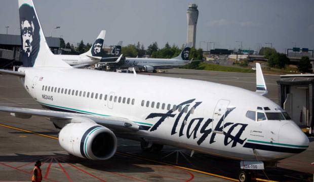 In this June 11, 2009 file photo, an Alaska Airlines airliner is pushed away from a gate at SeaTac Airport in SeaTac, Wash. (Associated Press file)