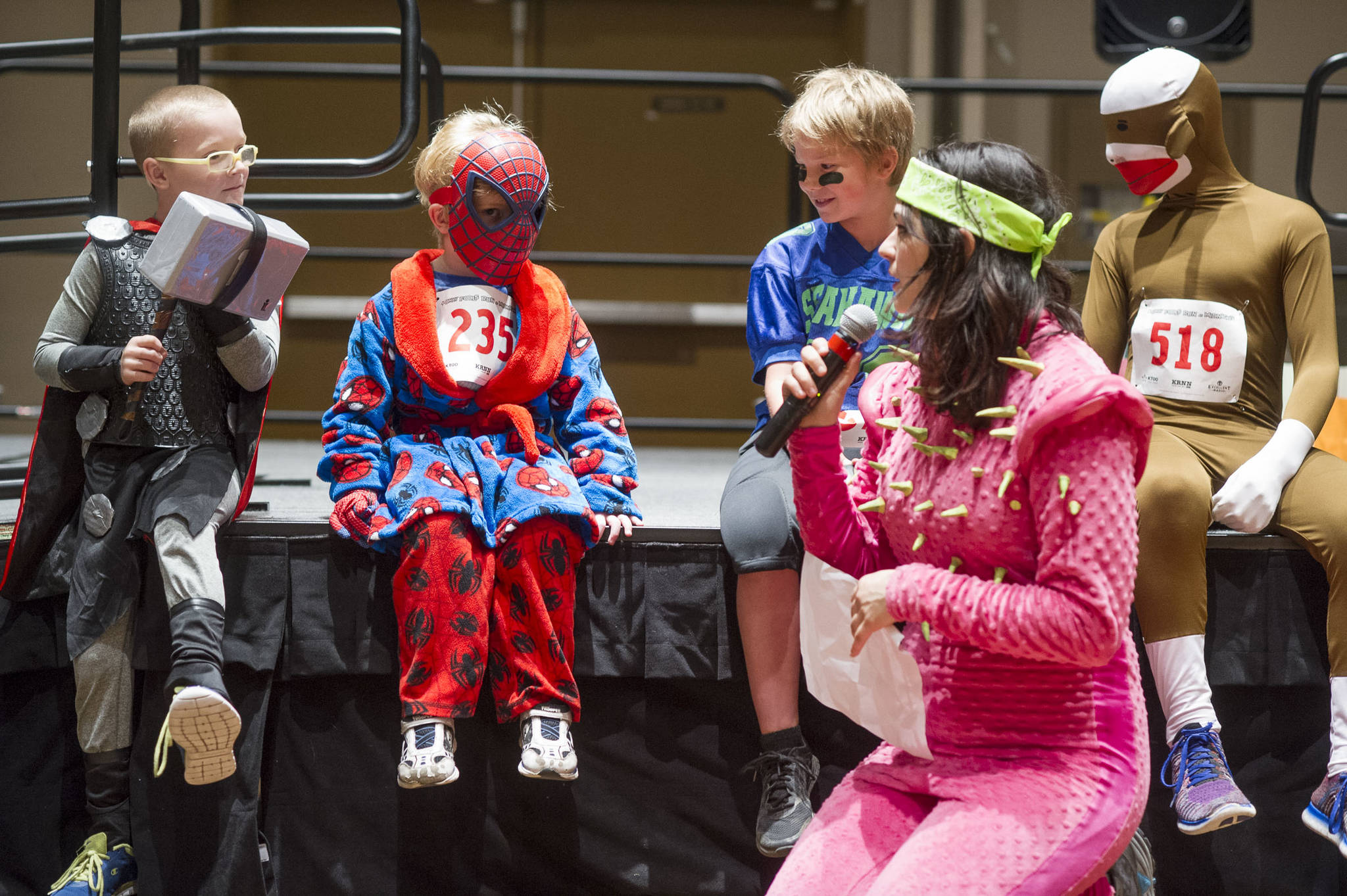 Annie Bartholomew emcees the costume contest before the 2016 Only Fools Run at Midnight Fun Run at Centennial Hall. The race will be housed at the Juneau Arts and Culture Center this year. (Michael Penn | Juneau Empire File)